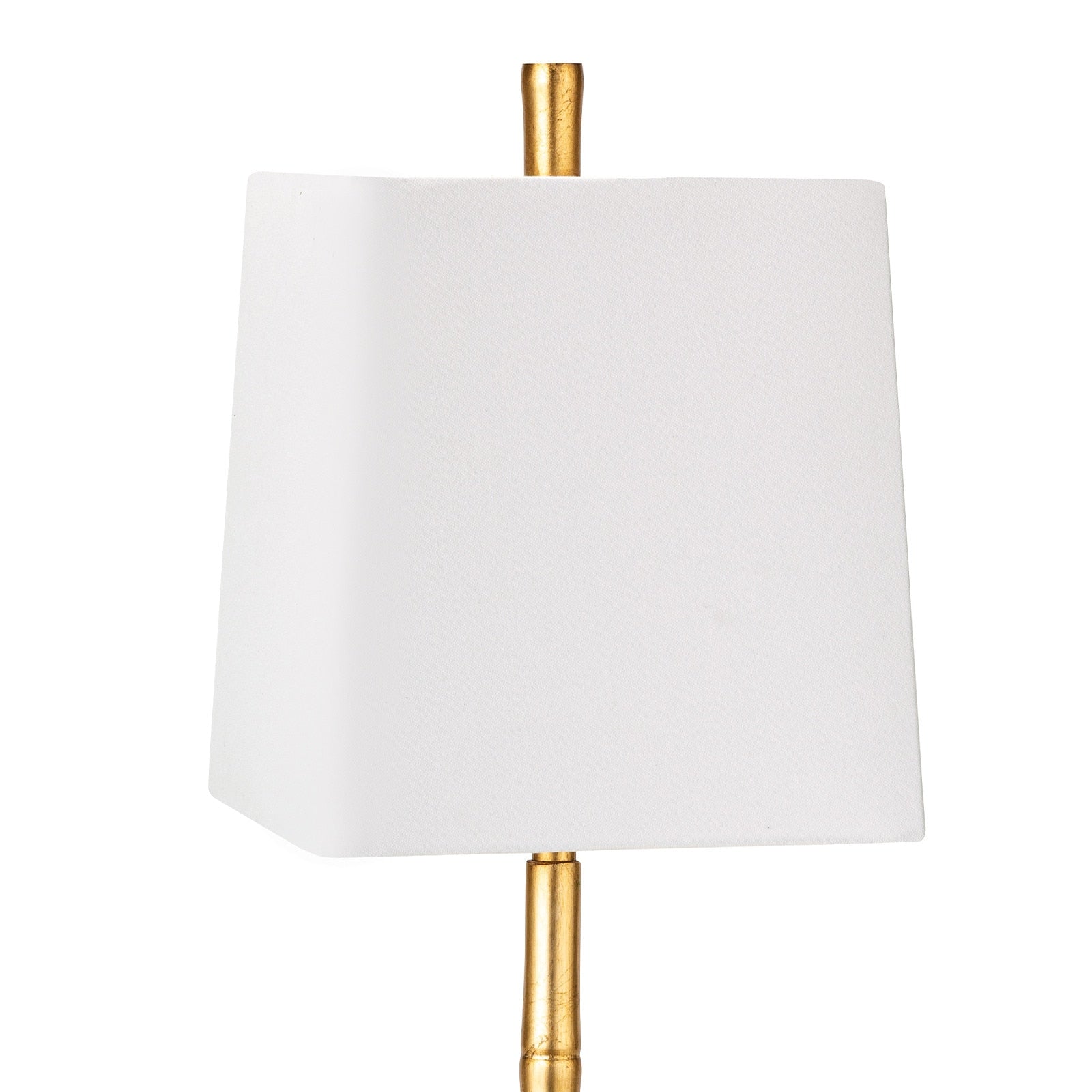 White lampshade with gold base on a white background