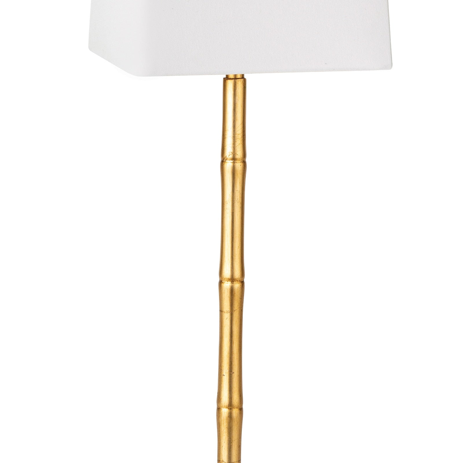 Gold lamp with a white shade on a white background