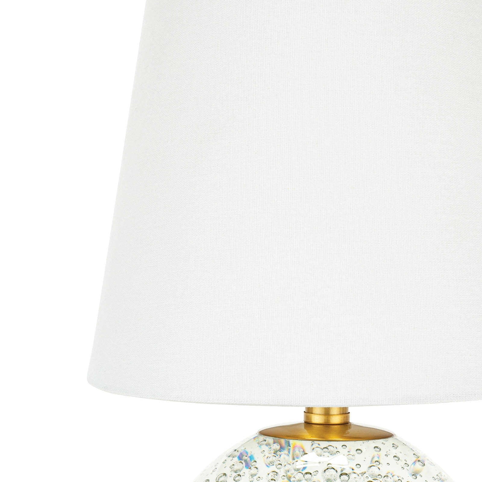 Bulle Crystal Mini Lamp (15" H) with a round clear crystal base containing internal bubbles, gilded neck, and a natural tapered linen shade.