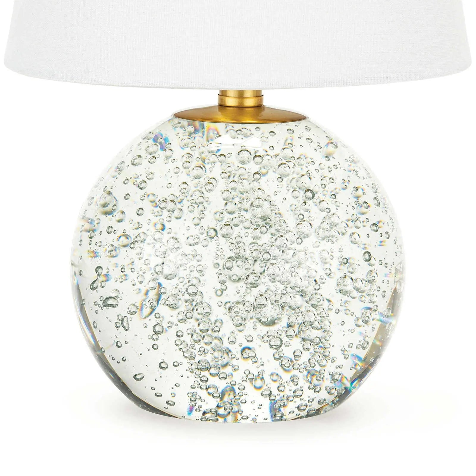 Bulle Crystal Mini Lamp (15" H) with a round clear crystal base containing internal bubbles, gilded neck, and a natural tapered linen shade.