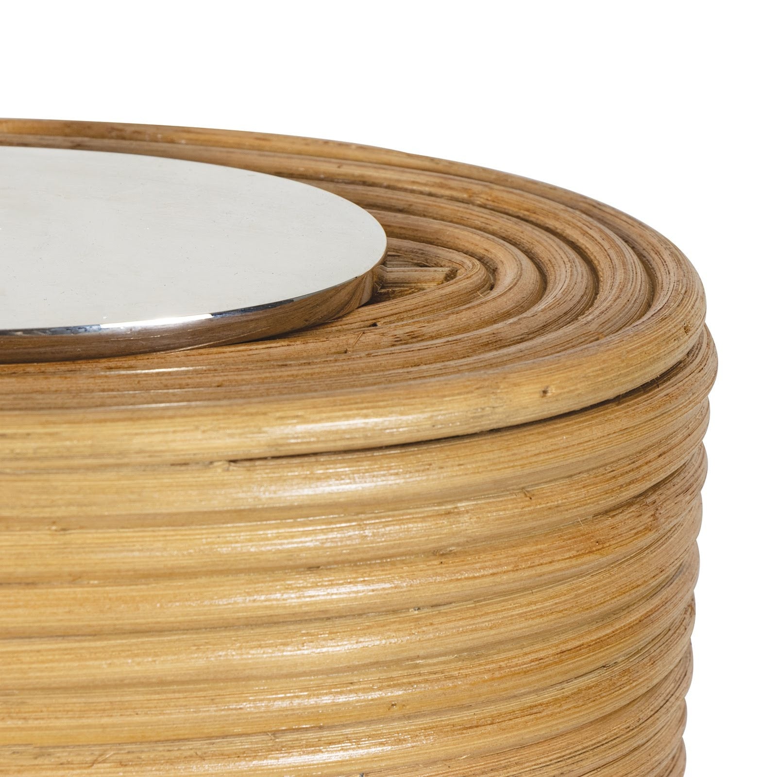 Close-up of a woven rattan table with a white circular object on top against a white background