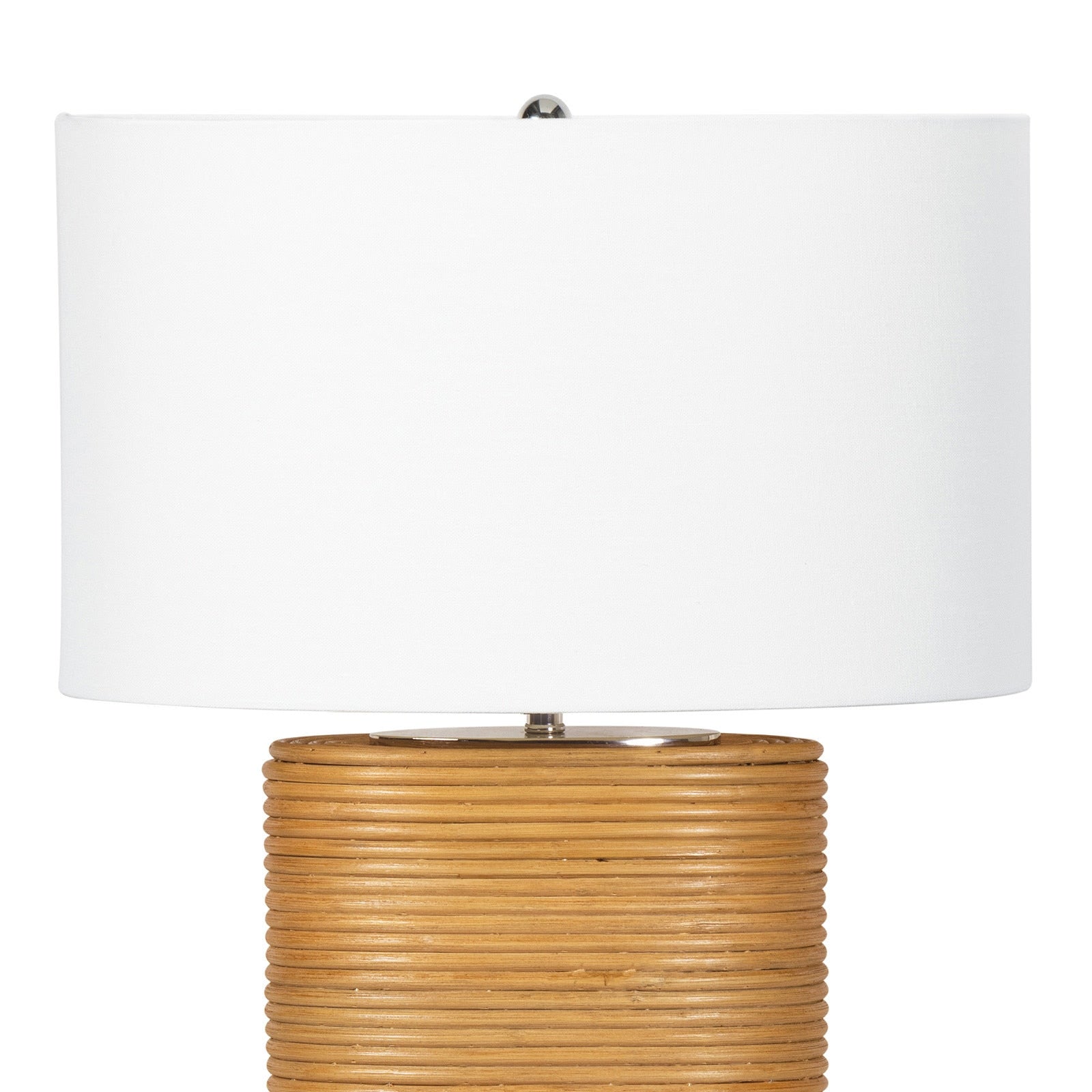 Table lamp with rattan base and white shade on a white background