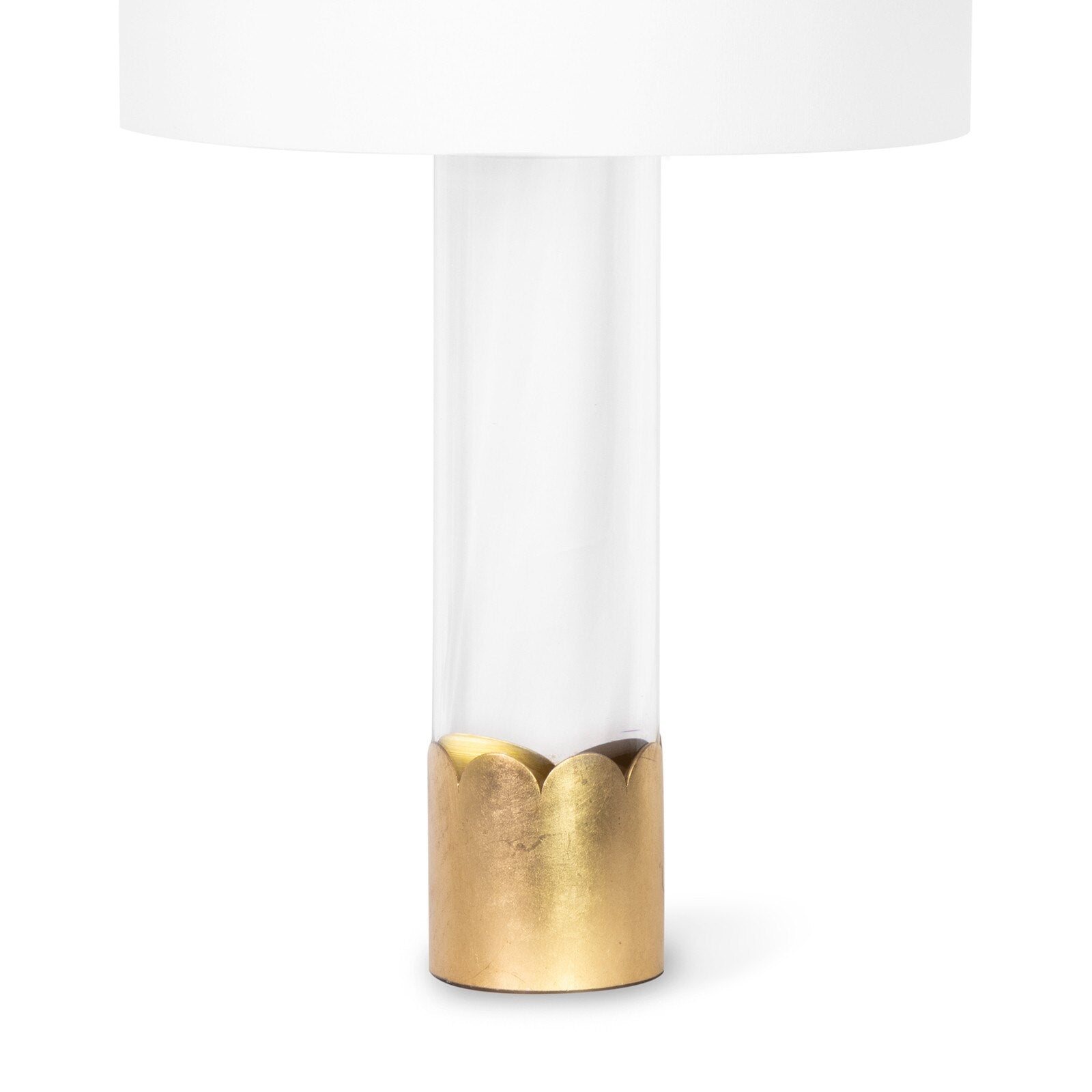 Table lamp with white shade and gold base on a white background