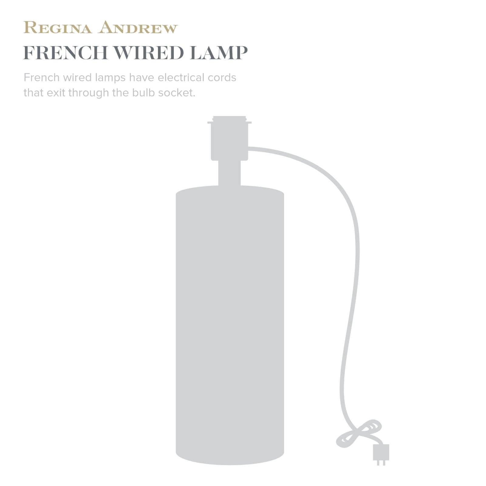 White lamp with electrical cord on a white background, featuring Regina Andrew design.