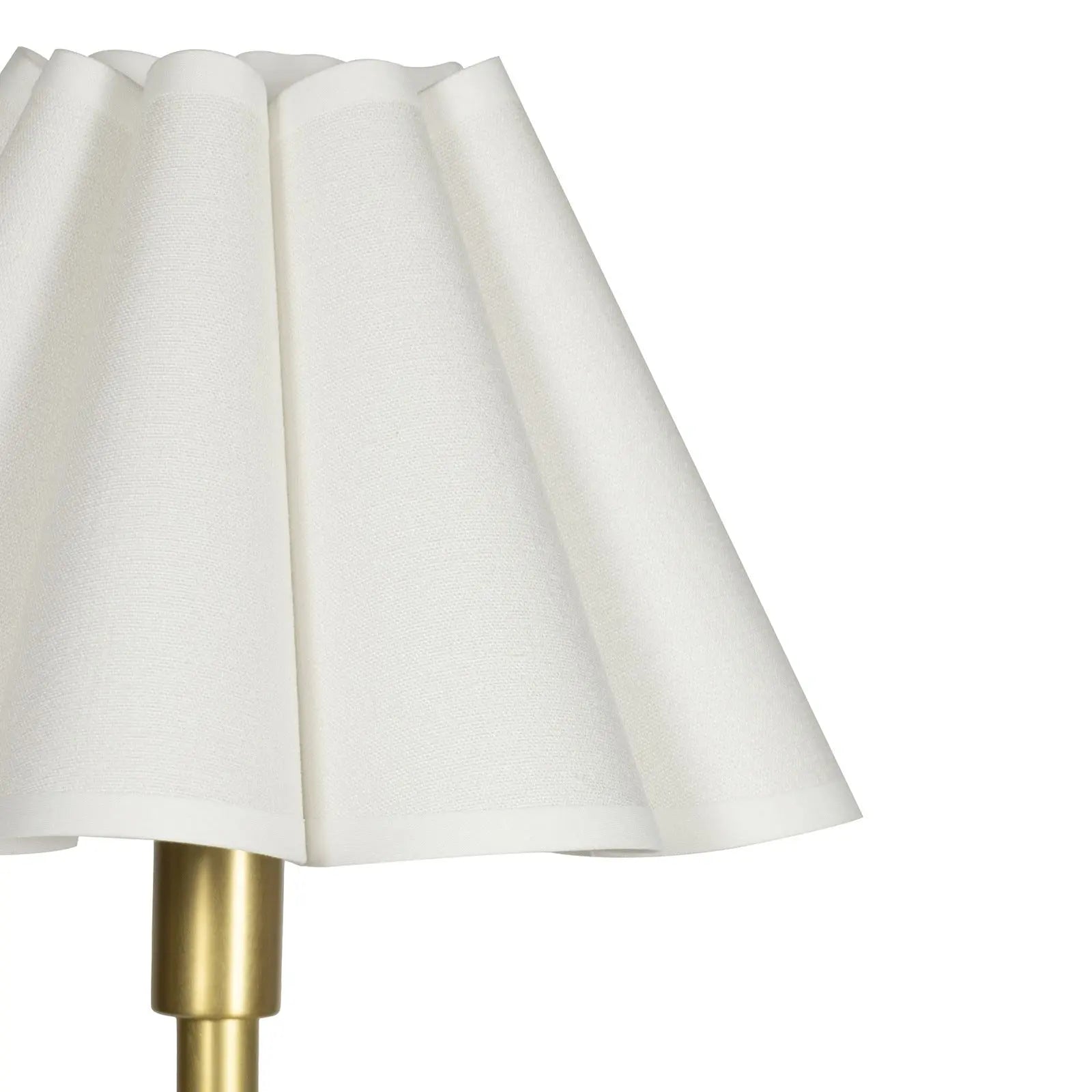 White lampshade with a gold base on a white background