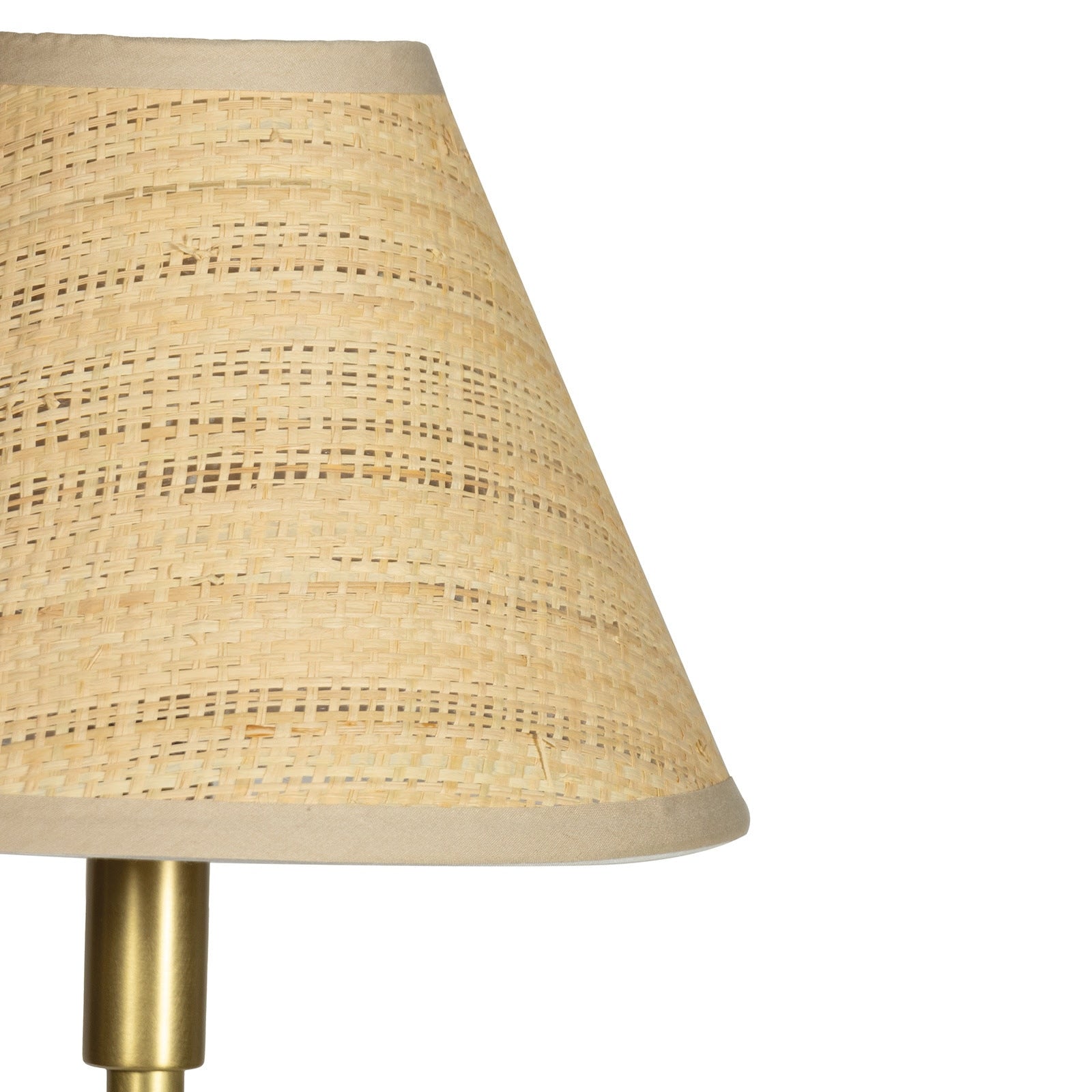Lamp with a woven beige shade on a white background