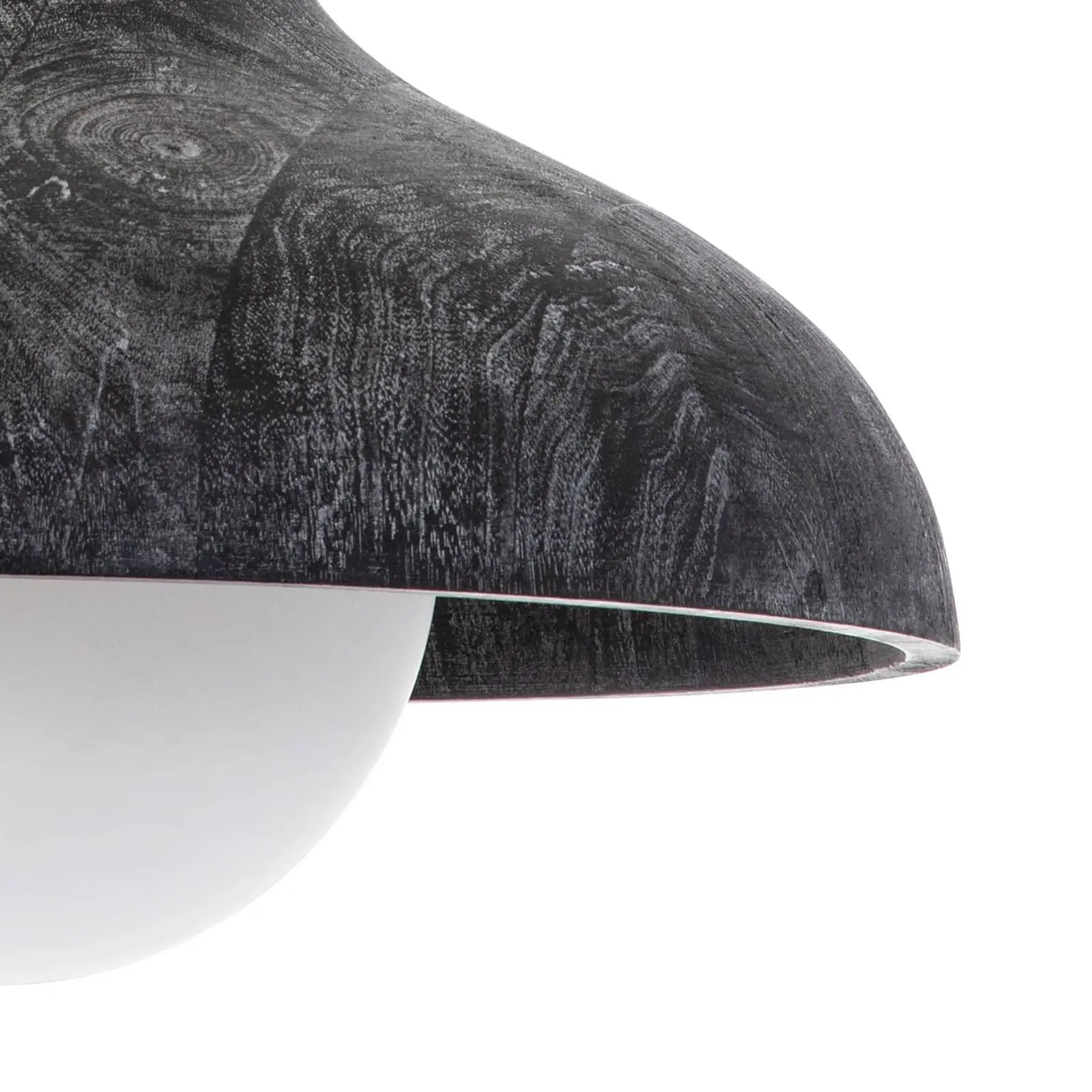 Close-up of a textured black and white lampshade on a white background