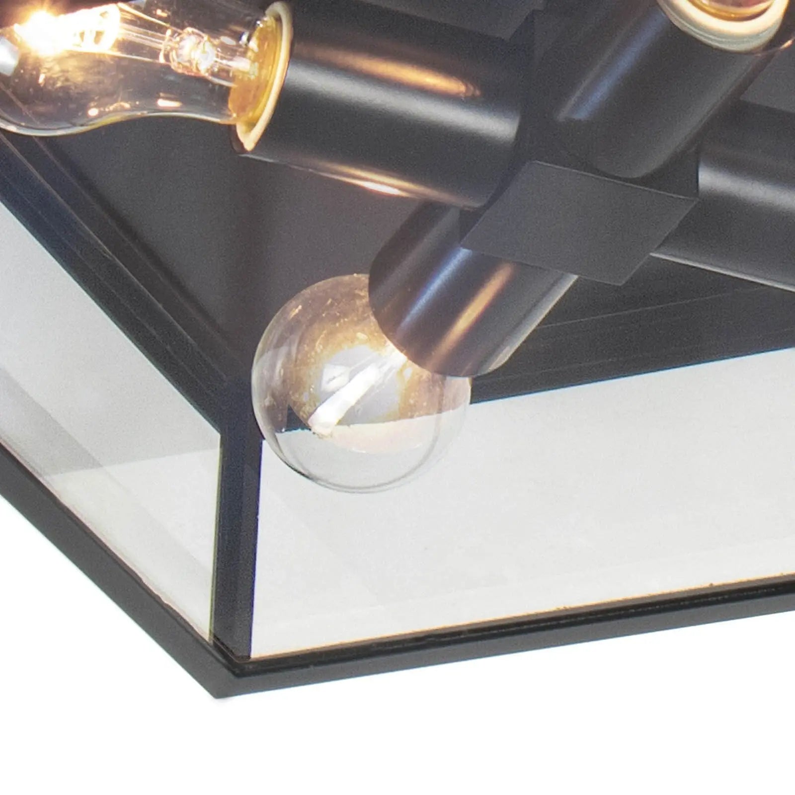 Modern ceiling light fixture with black finish and glass shades on a white background