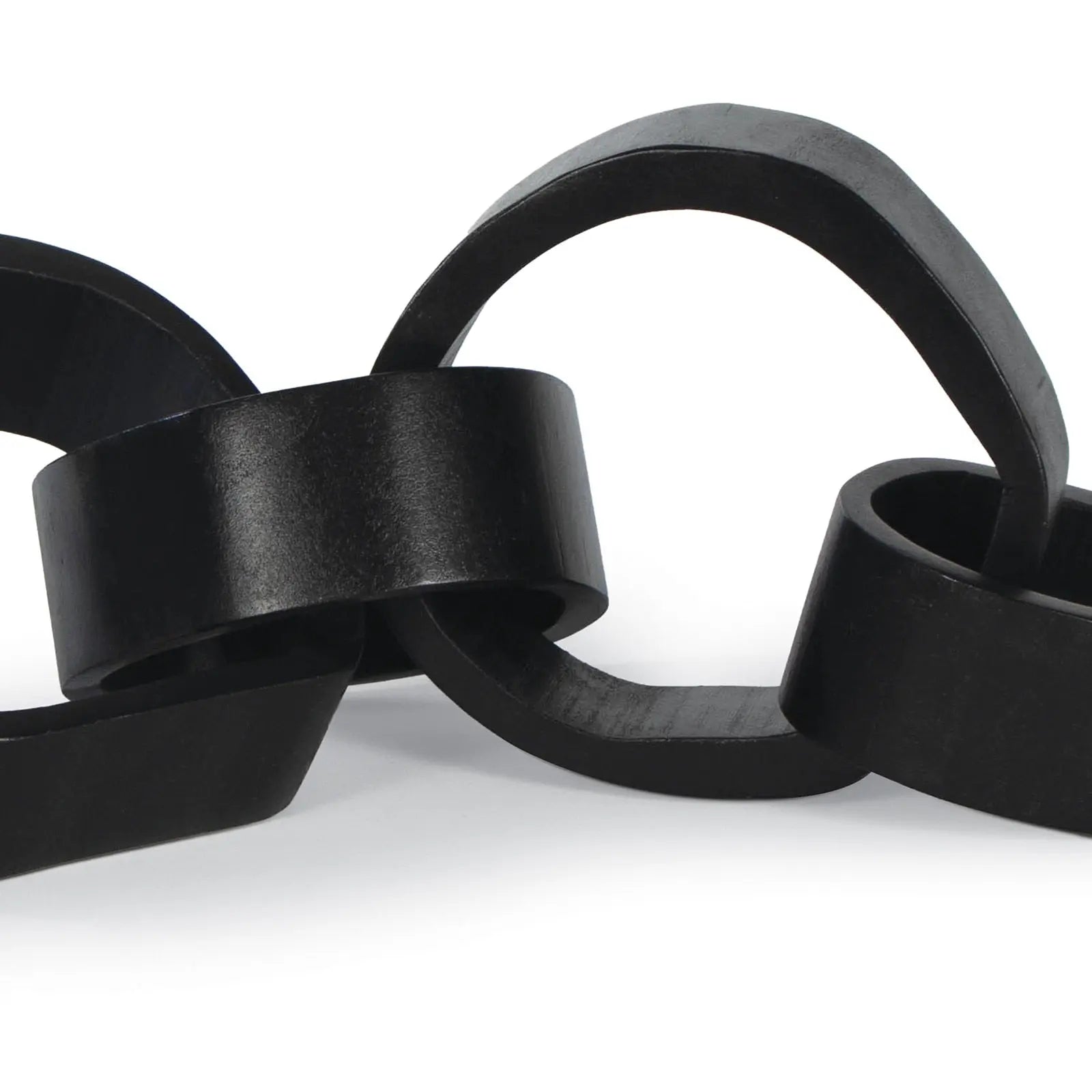 Close-up of a black chain link on a white background
