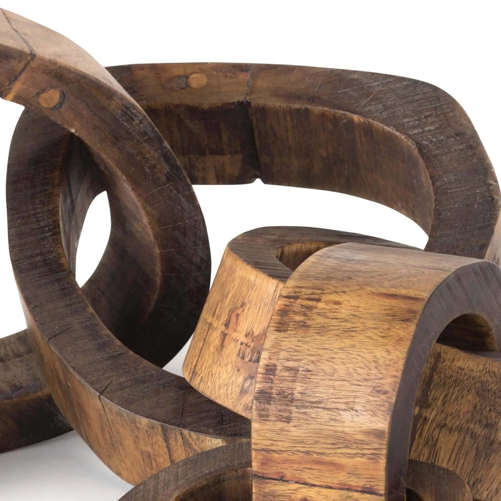 Wooden sculpture with interlocking rings on a white background