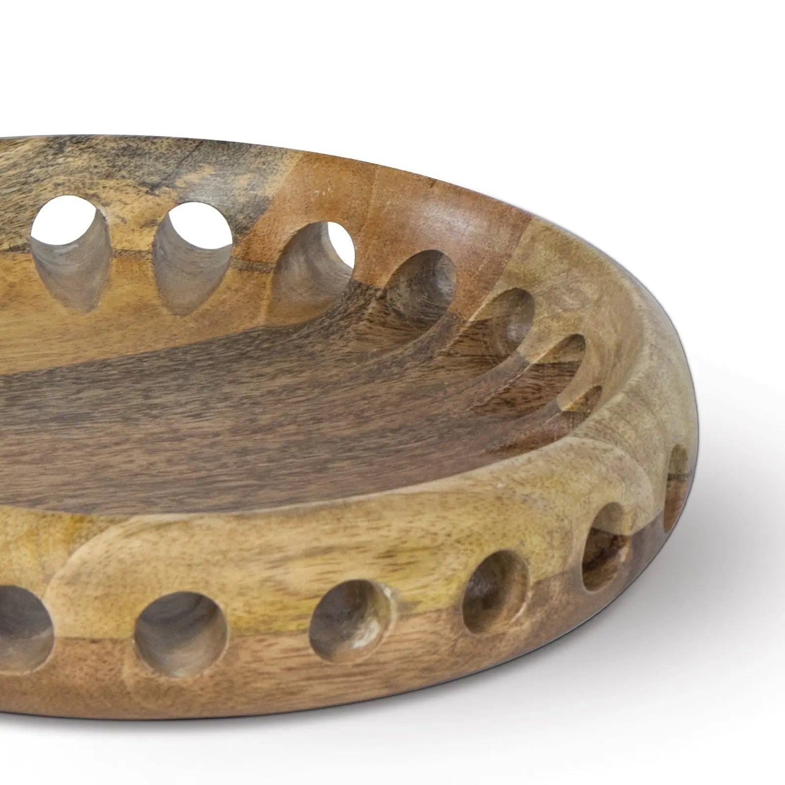 Wooden bowl with circular holes on a white background