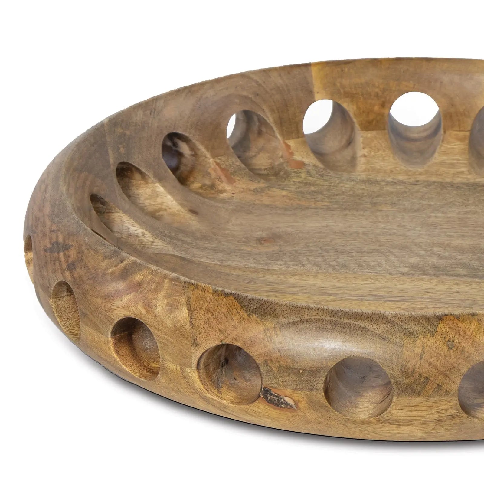Wooden bowl with circular holes on a white background