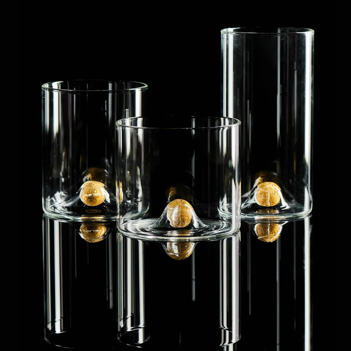 Set of four Golden Globe Double Old-Fashioned Glasses, each featuring a clear glass body with a small gold ball fused into the base