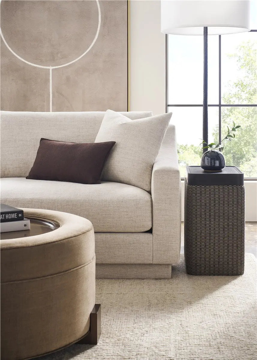 A long, sophisticated 94-inch Asher Sofa with softly sloped arms and a fully upholstered base in a light gray Thriller Linen performance fabric.