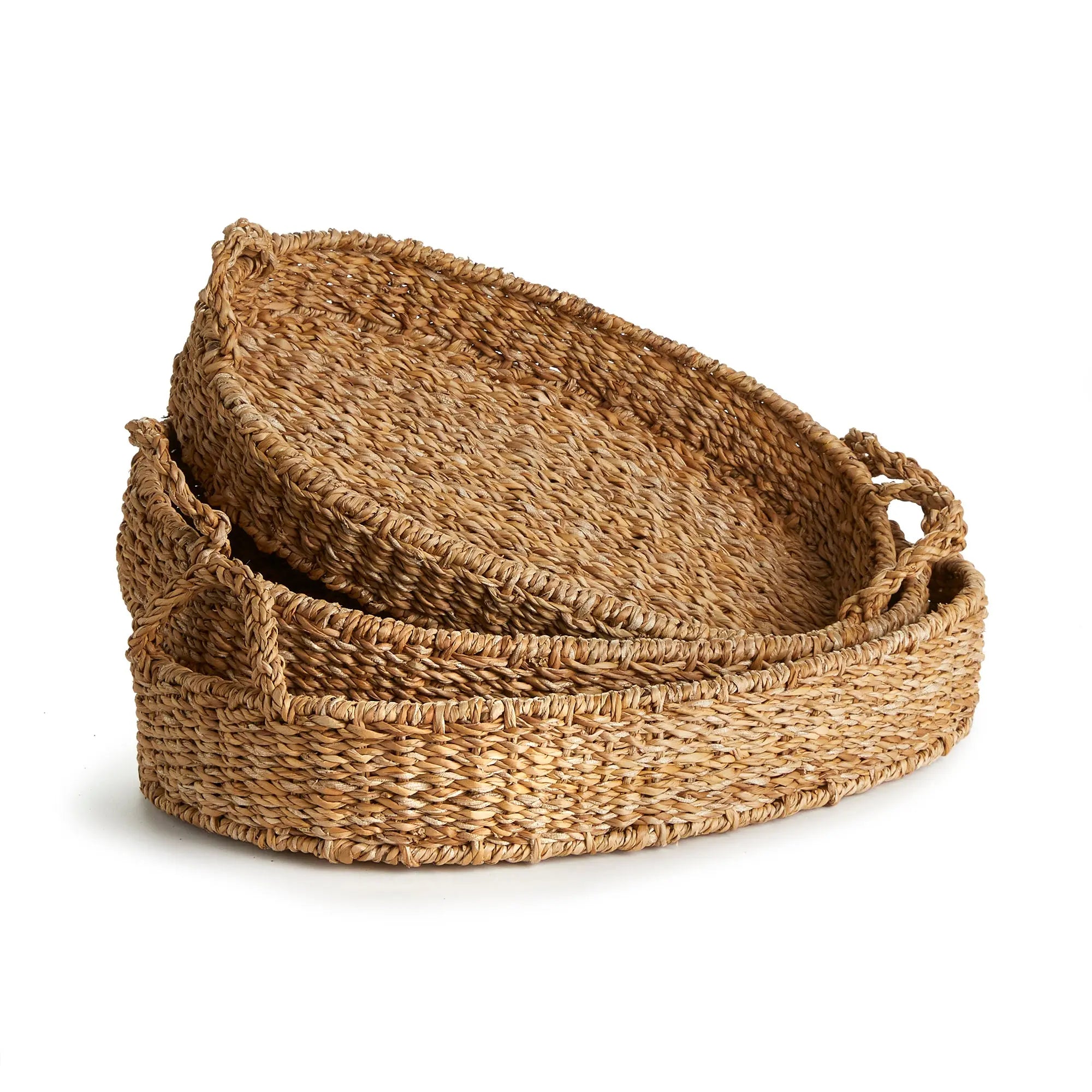 Set of three woven baskets on a white background