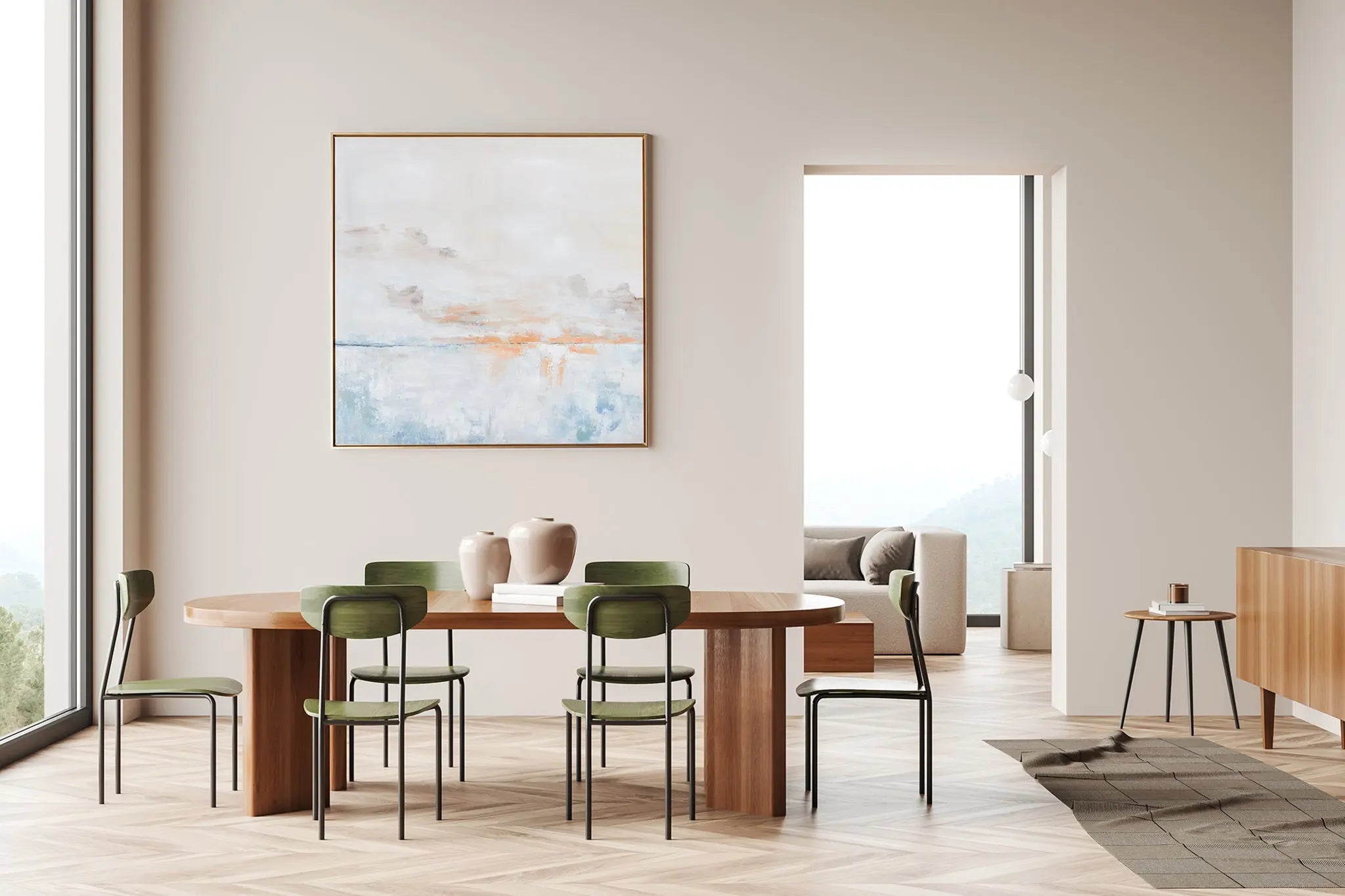 A square piece of wall art titled "After the Storm" showing a serene sky with soft, muted tones of blue, gray, and white, with hand-painted highlights, enclosed in a thin gold frame.