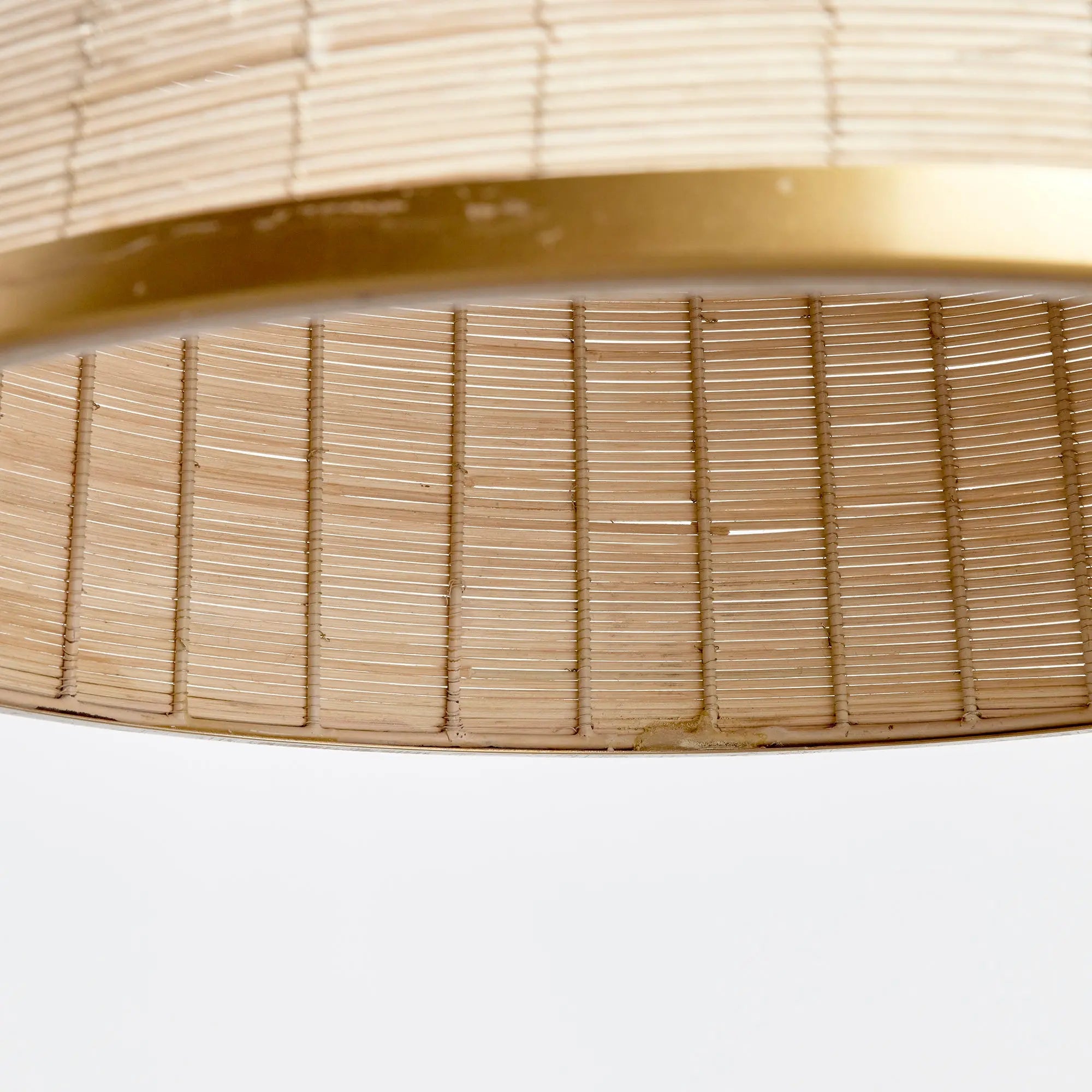 Maye Bell Pendant made of whitewashed rattan with brass accents