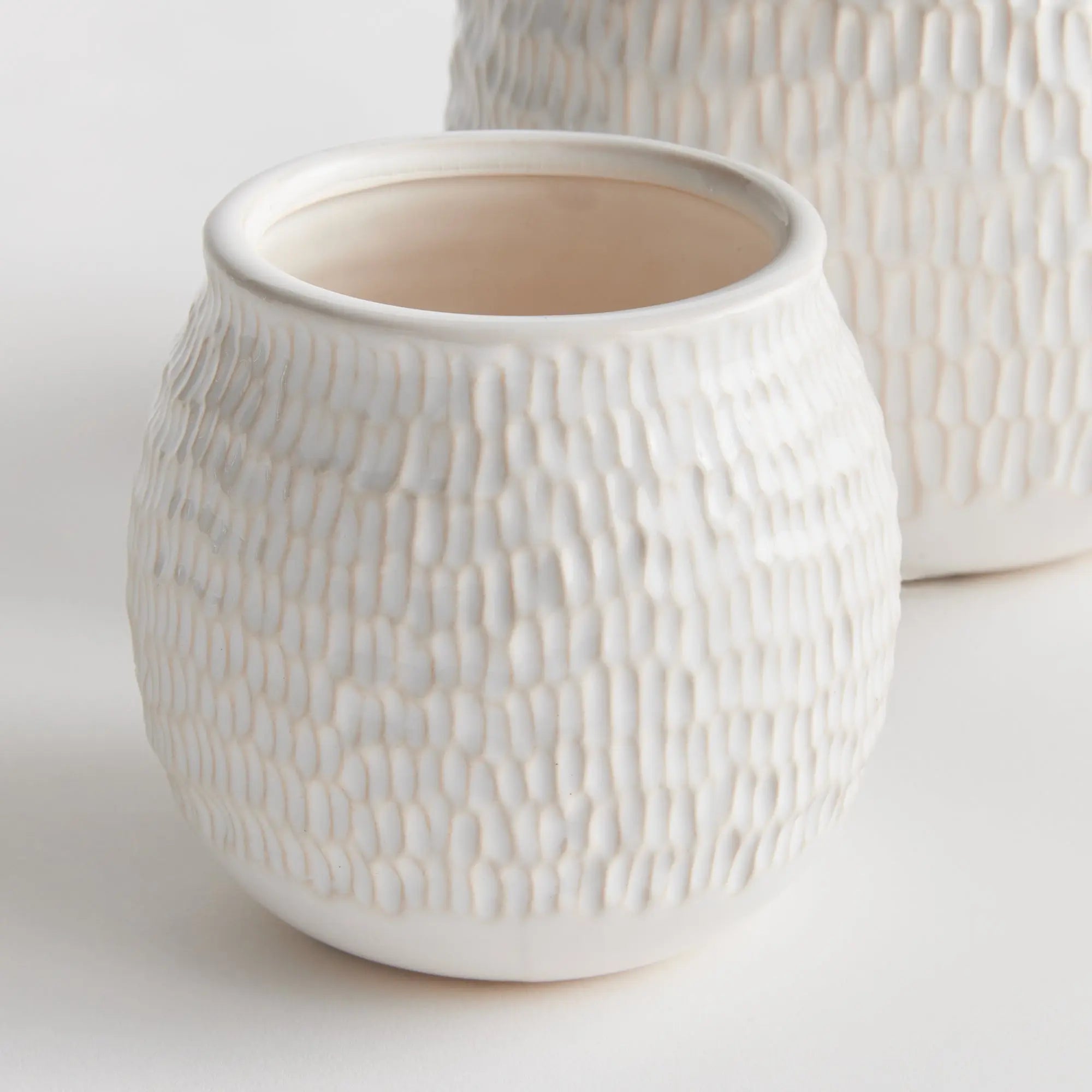 Artisan white pottery planters with drainage for indoor plants