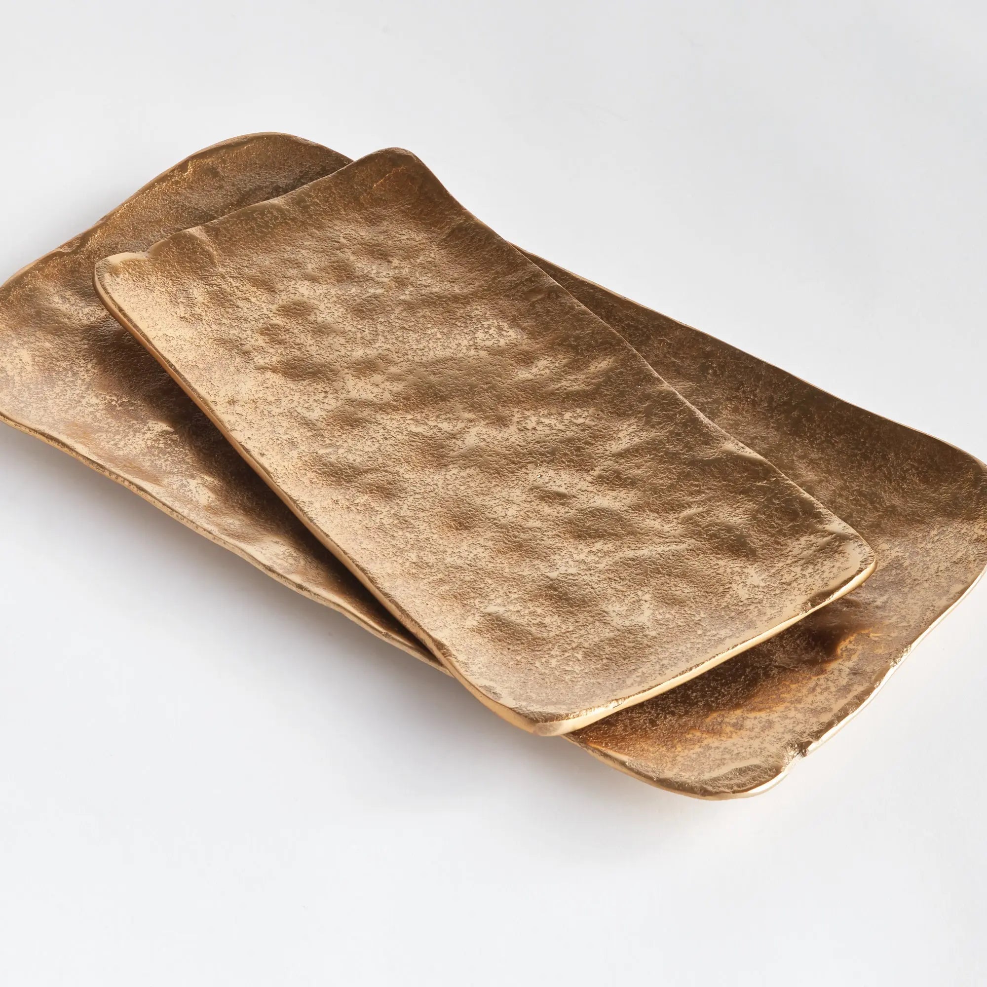 Imani Decorative Trays - modern gold cast aluminum trays with rounded edges, available in rectangular set of 2 or square set of 3