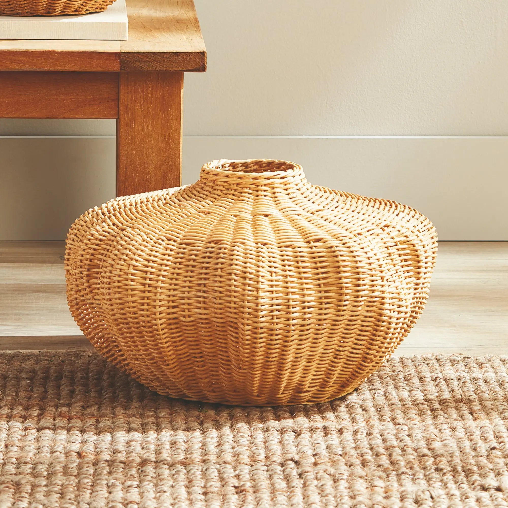 Handwoven short rattan vase with sculptural shape