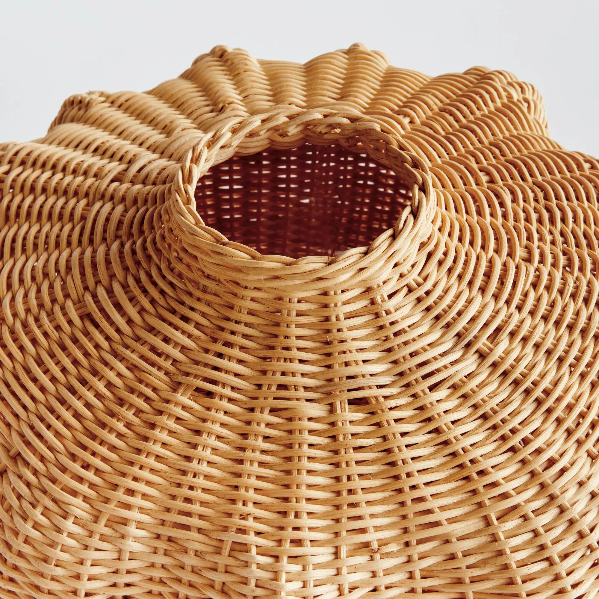 Handwoven short rattan vase with sculptural shape
