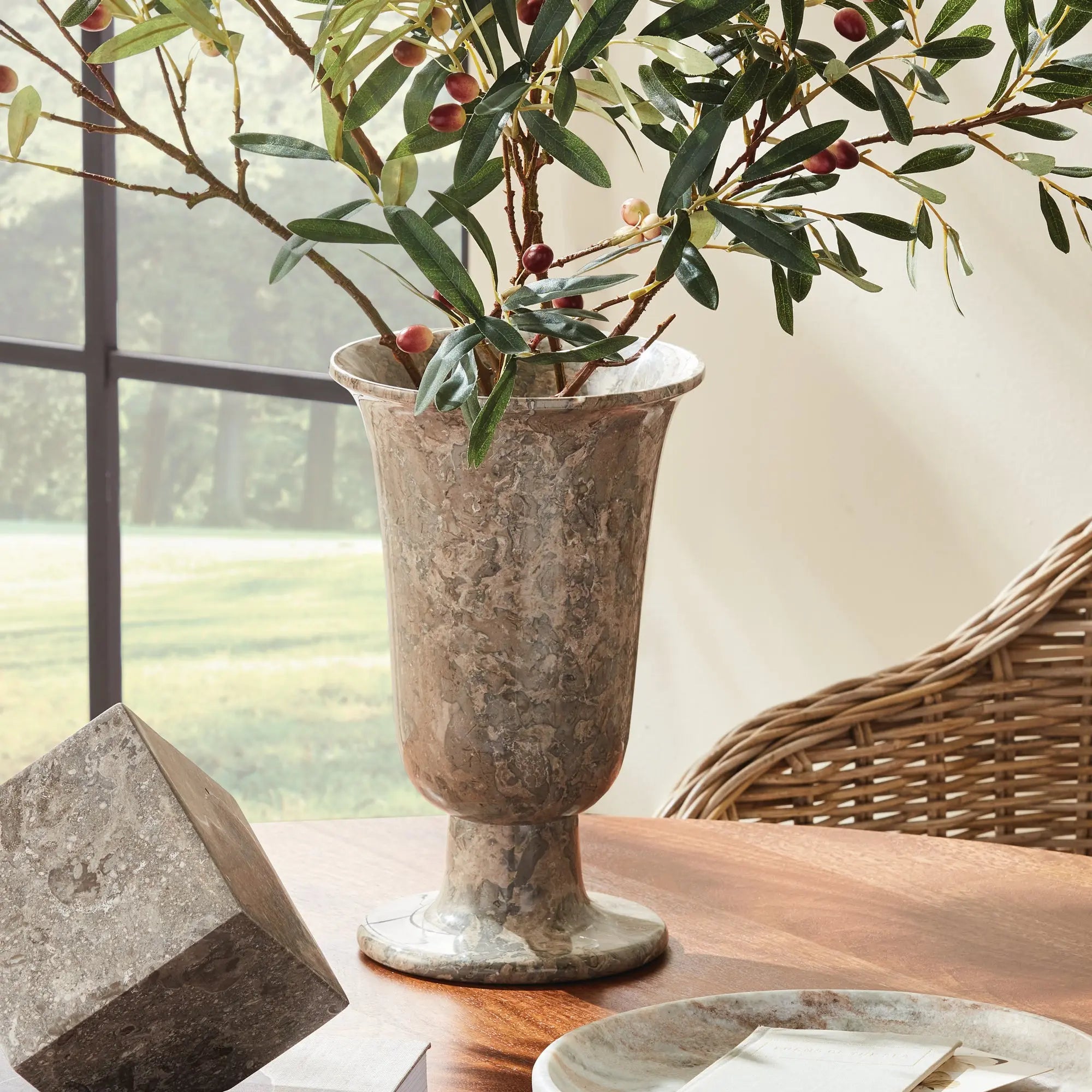 Claria footed vase in natural marble with brown veining