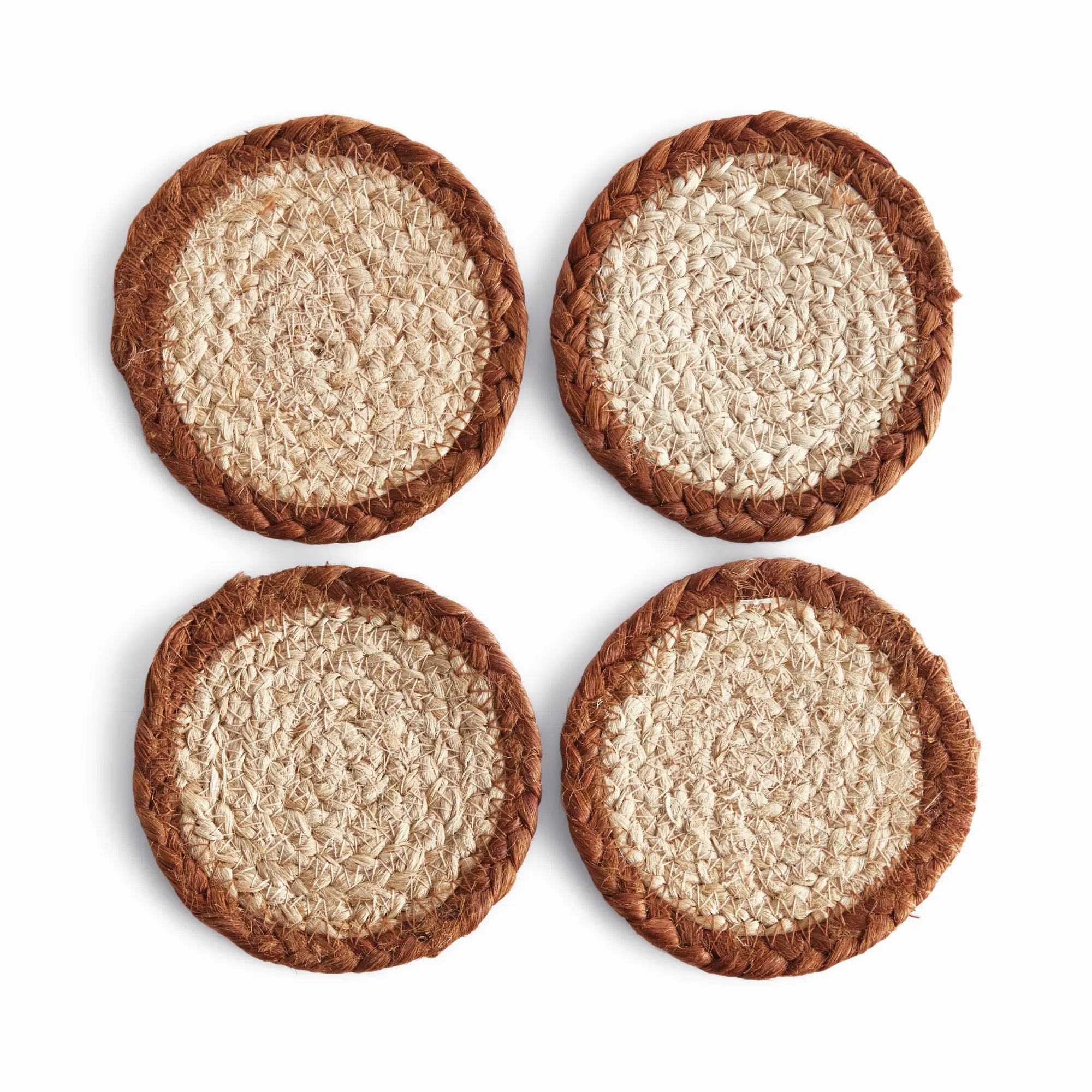 Four woven coasters with a textured surface on a white background