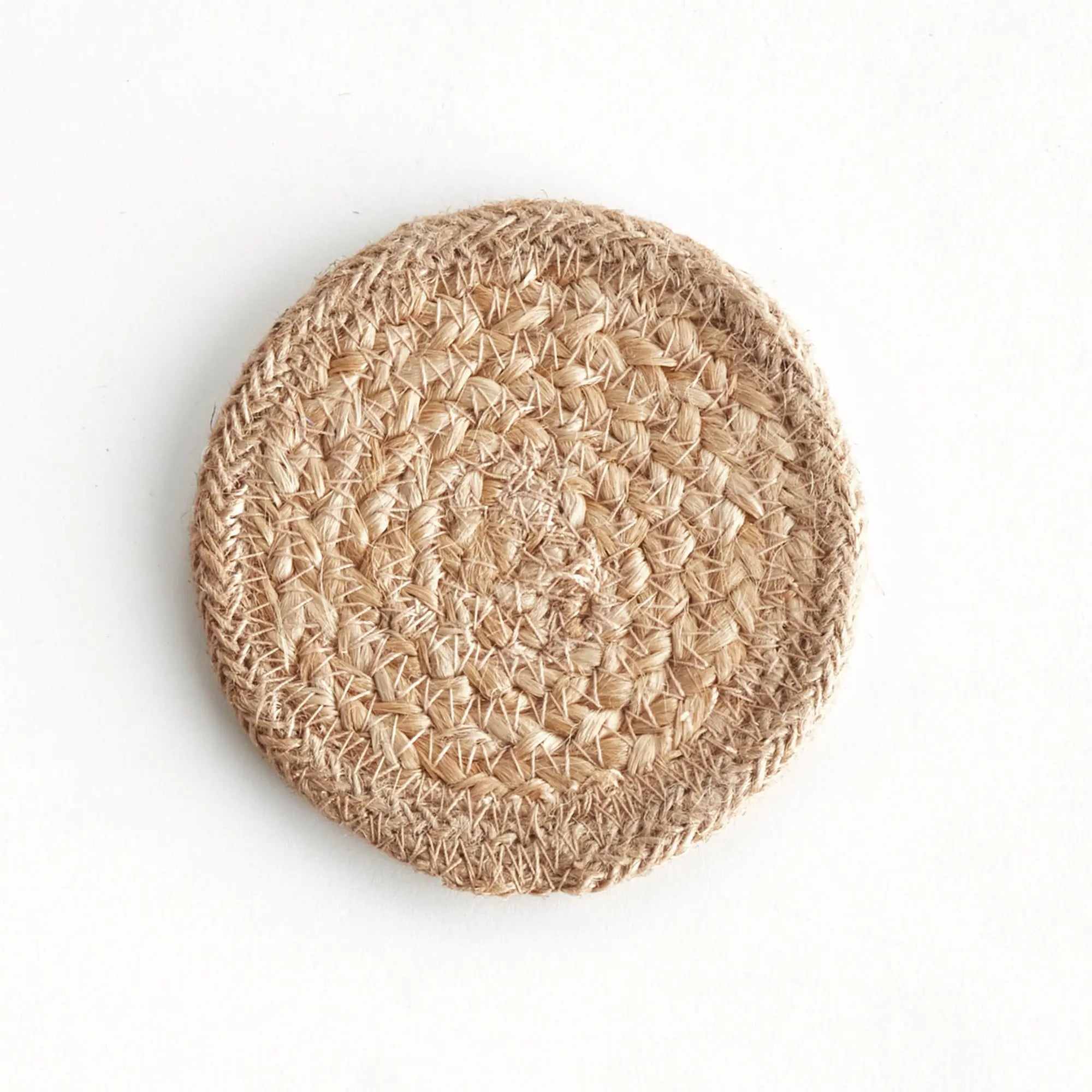 Round woven coaster on a white background