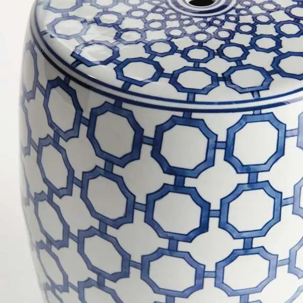 Barclay Butera Dynasty Link Stool, showing a blue and white ceramic stool with a classic chinoiserie-inspired link pattern. The stool is cylindrical and is shown against a plain background to highlight its intricate design.