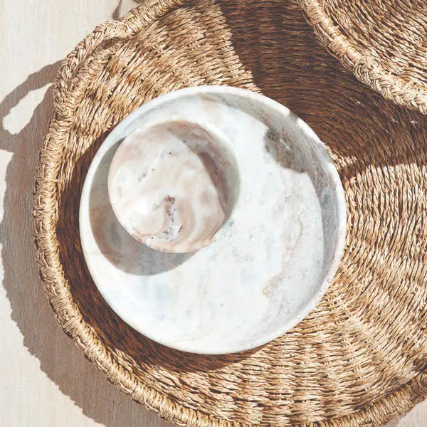 Round Josephine Marble Tray with a flat surface and low rim, featuring distinctive broad brown and light brown veins on a white marble base with a honed finish.