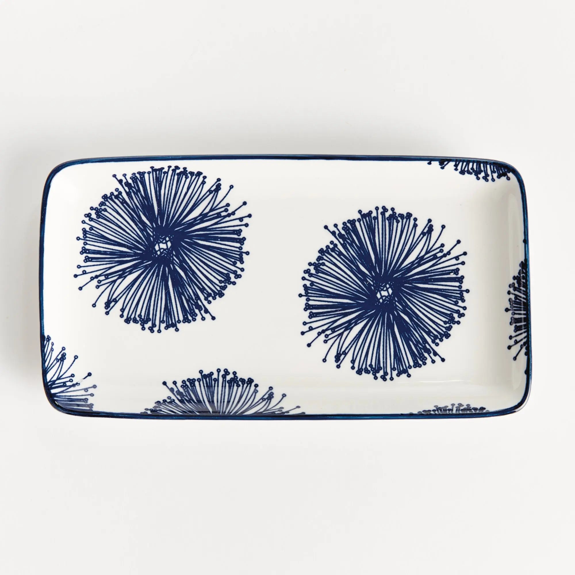 Stria Starburst 8" Trays Set of 4 - dark blue and white ceramic serving trays with starburst radiating pattern for appetizers and entertaining