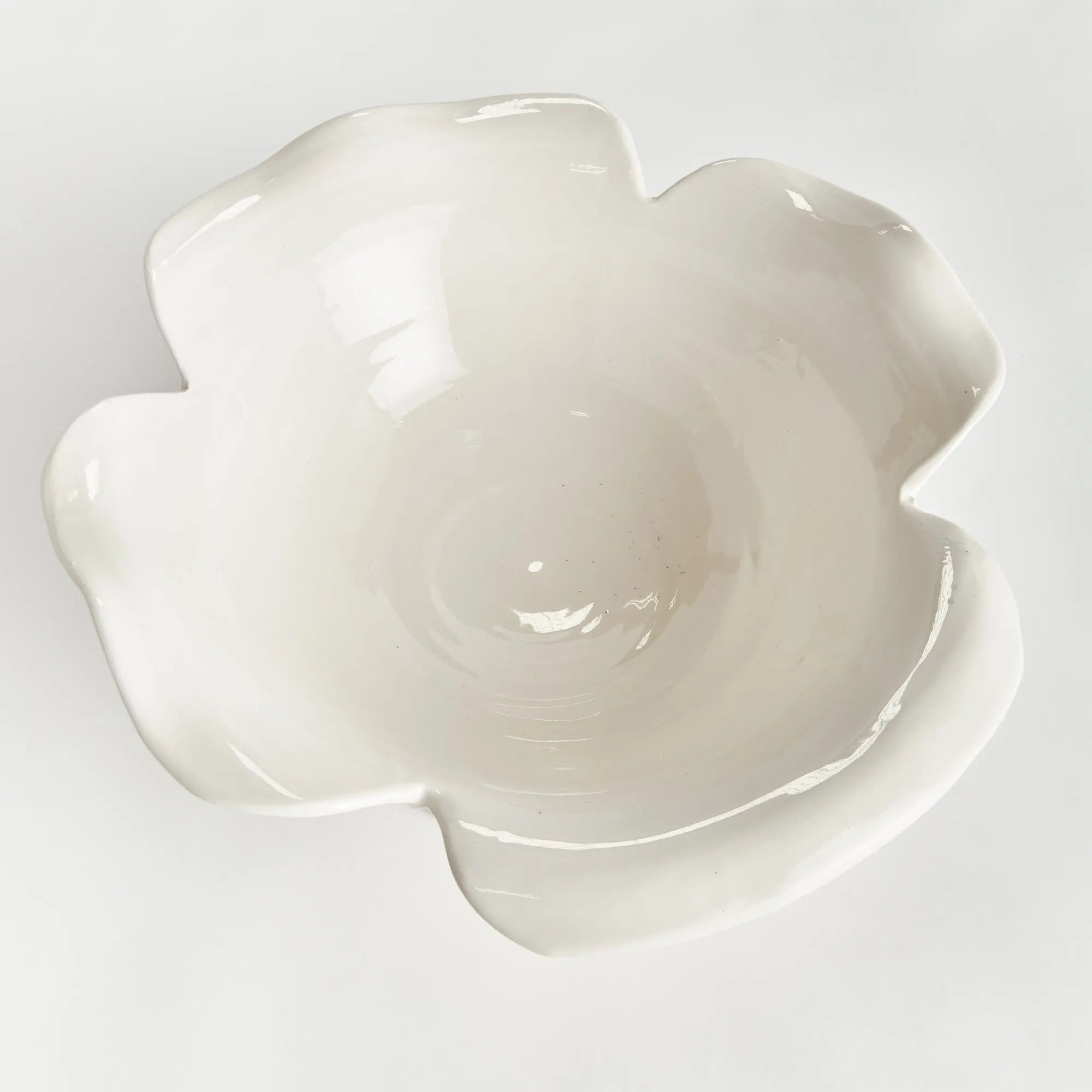 Handmade ceramic footed bowl with petal design in white glaze