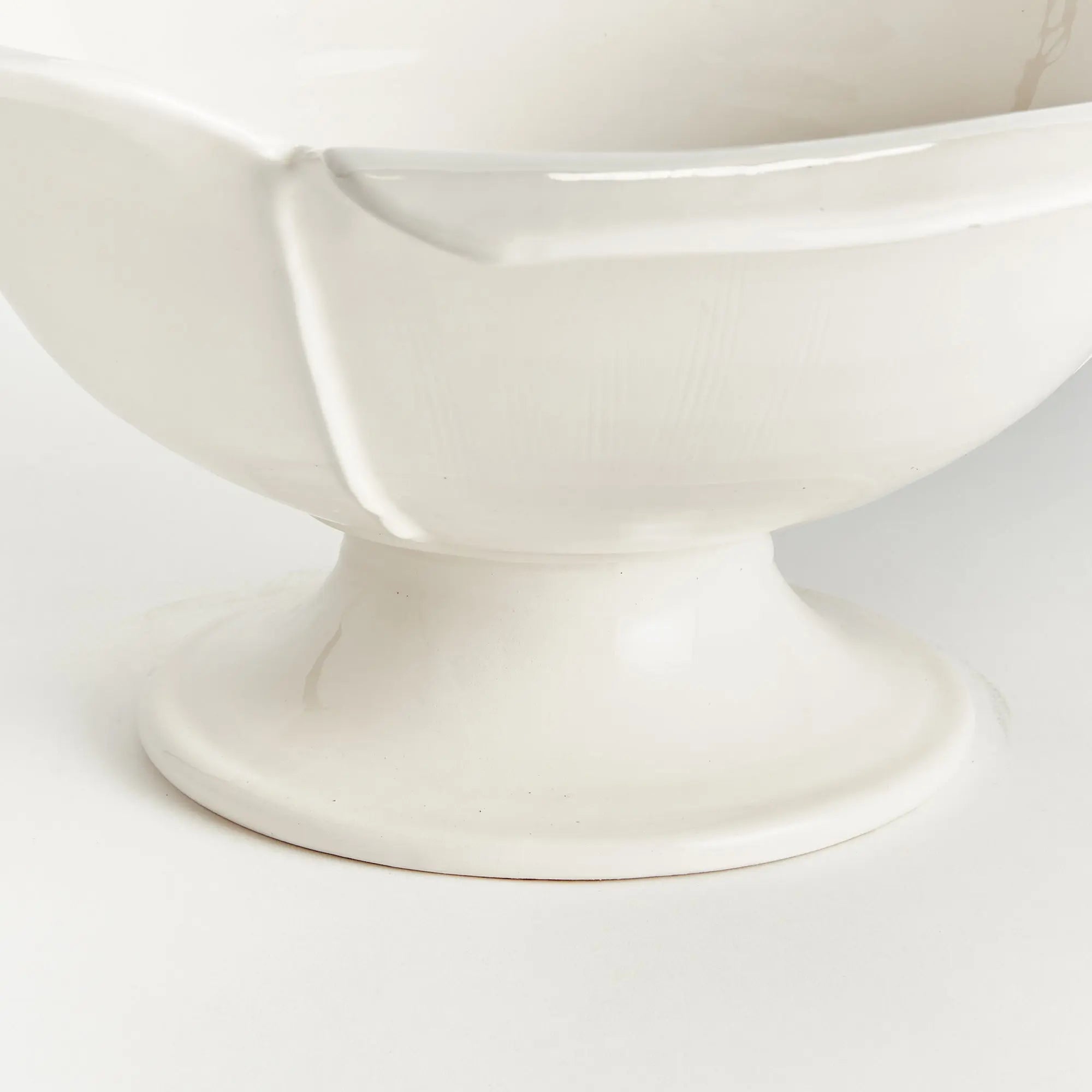 Handmade ceramic footed bowl with petal design in white glaze
