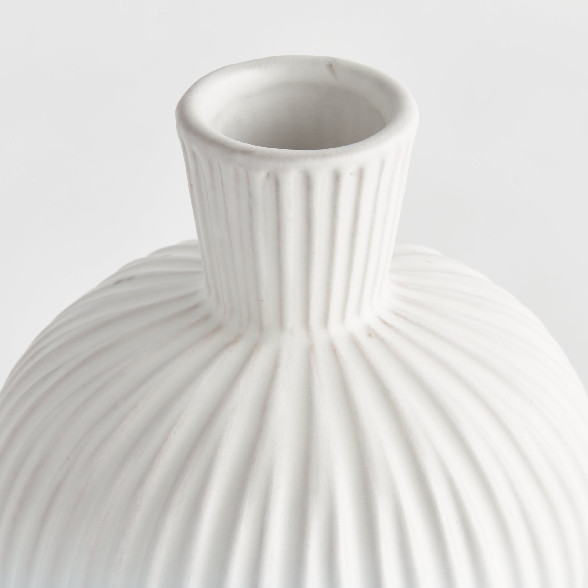 Large white ribbed ceramic Pravi Vase with bottle silhouette