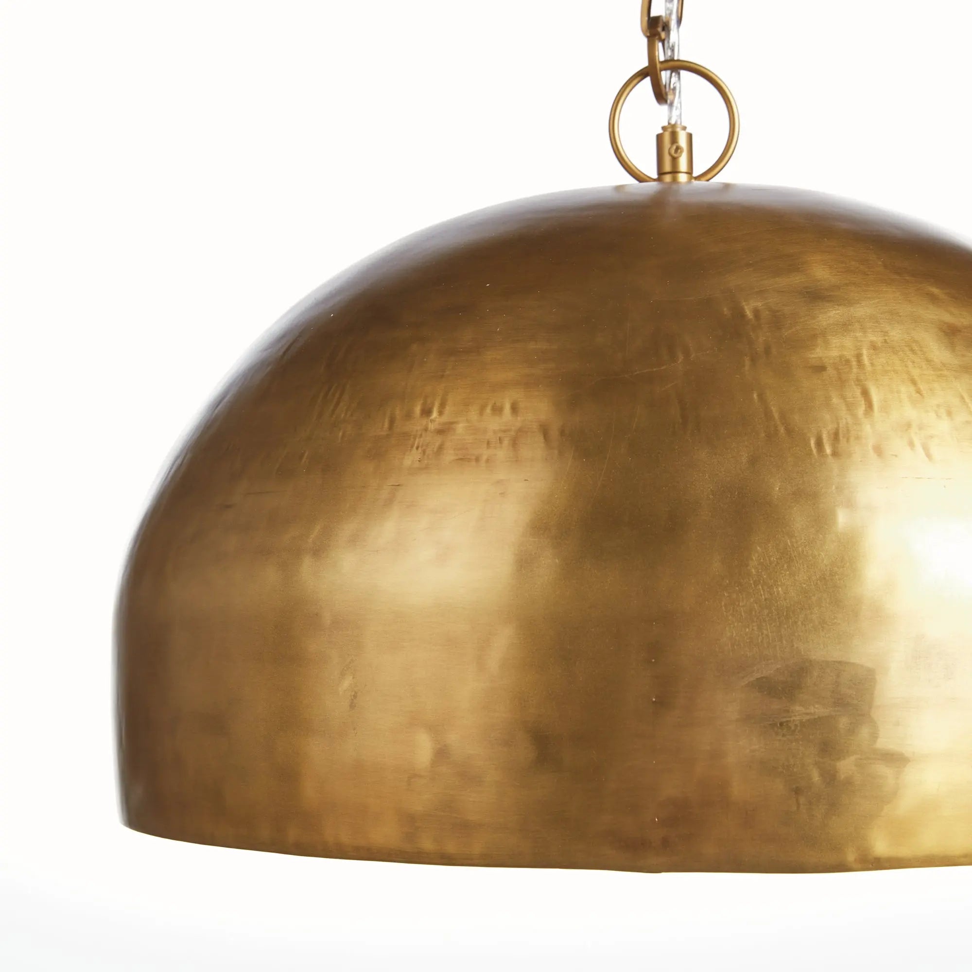 Brass pendant light on a white background