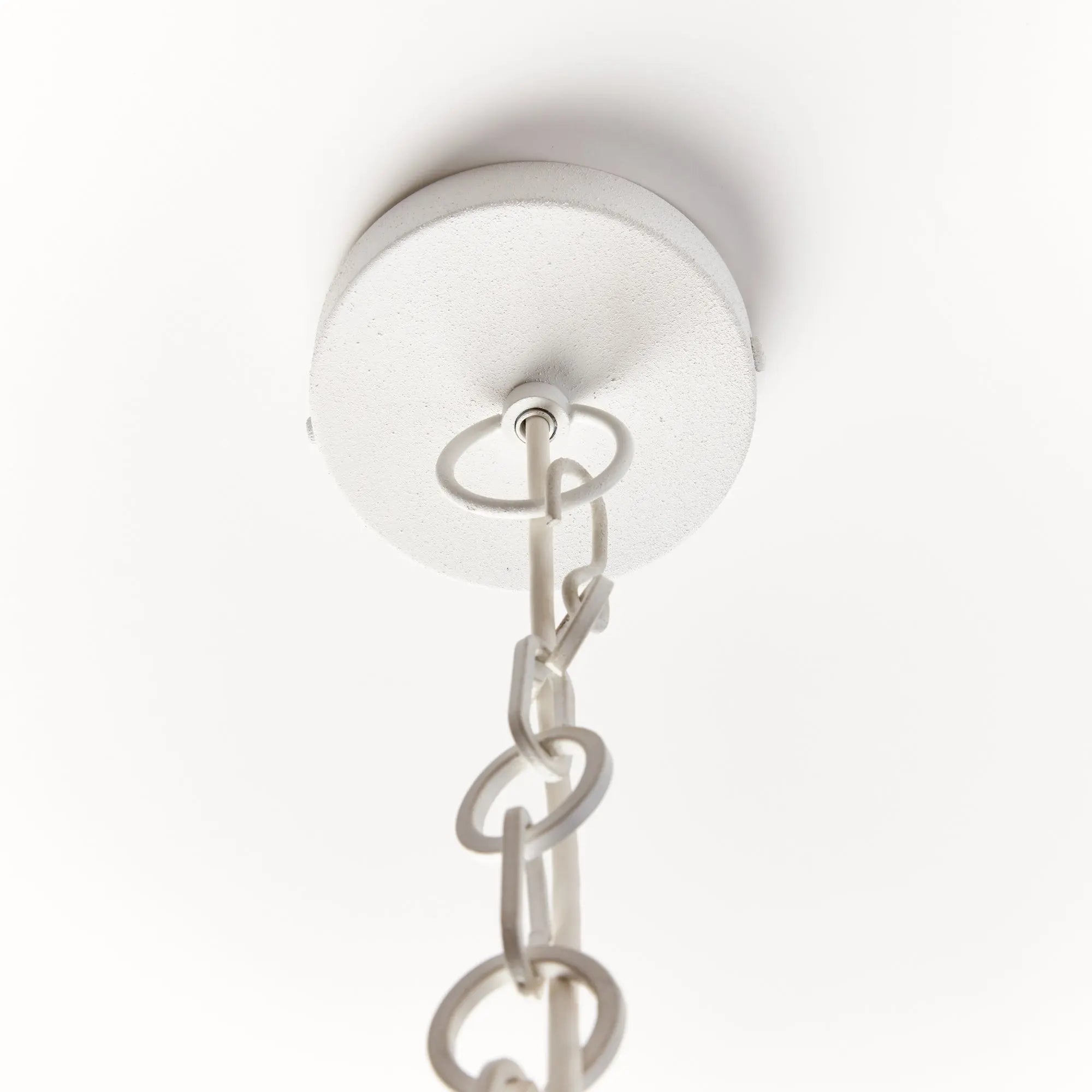 Ceiling light fixture with chain on a white background
