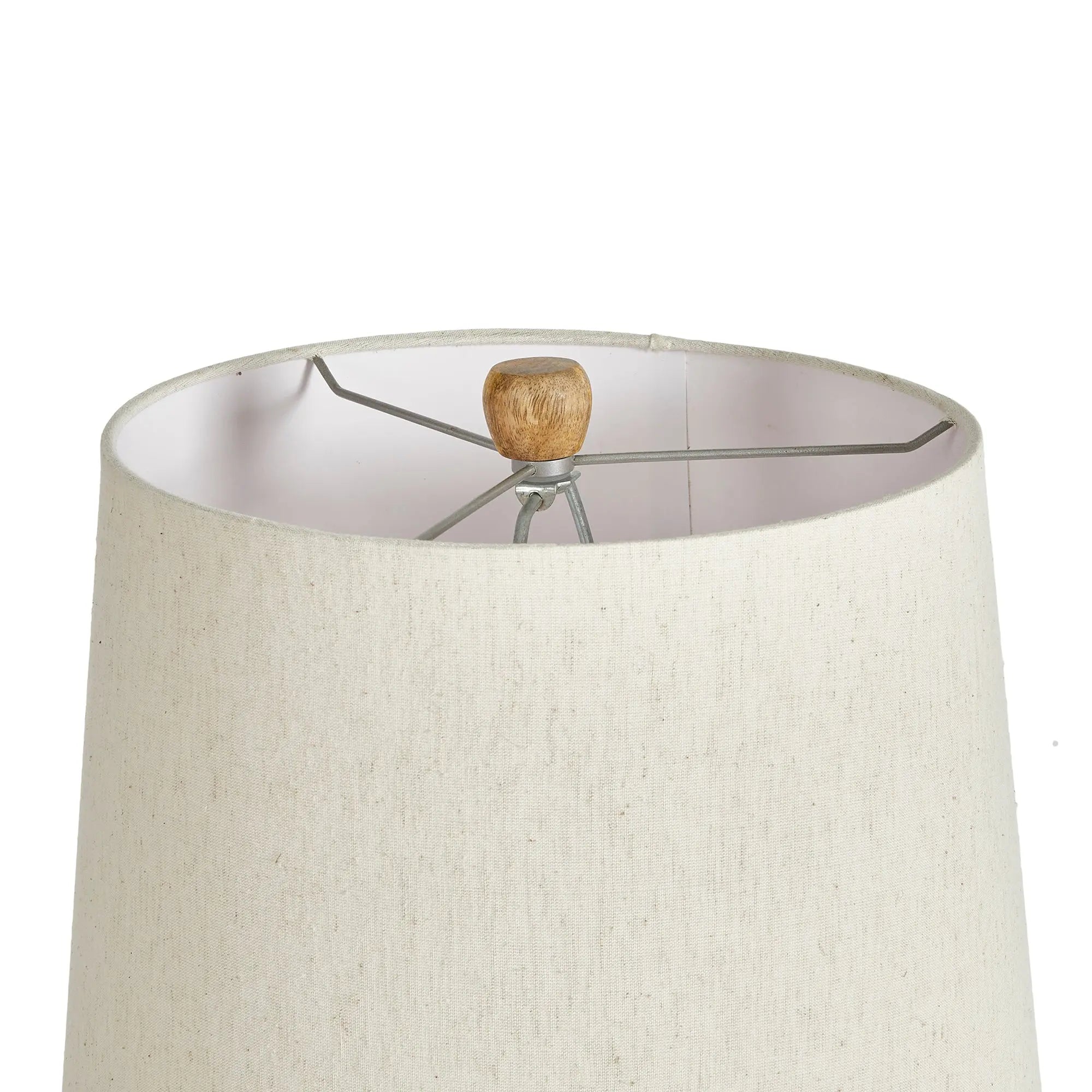 Adria Table Lamp with a textured, pitted, warm white ecomix base and a cream-colored tapered lamp shade. The lamp is shown from the front against a neutral background.
