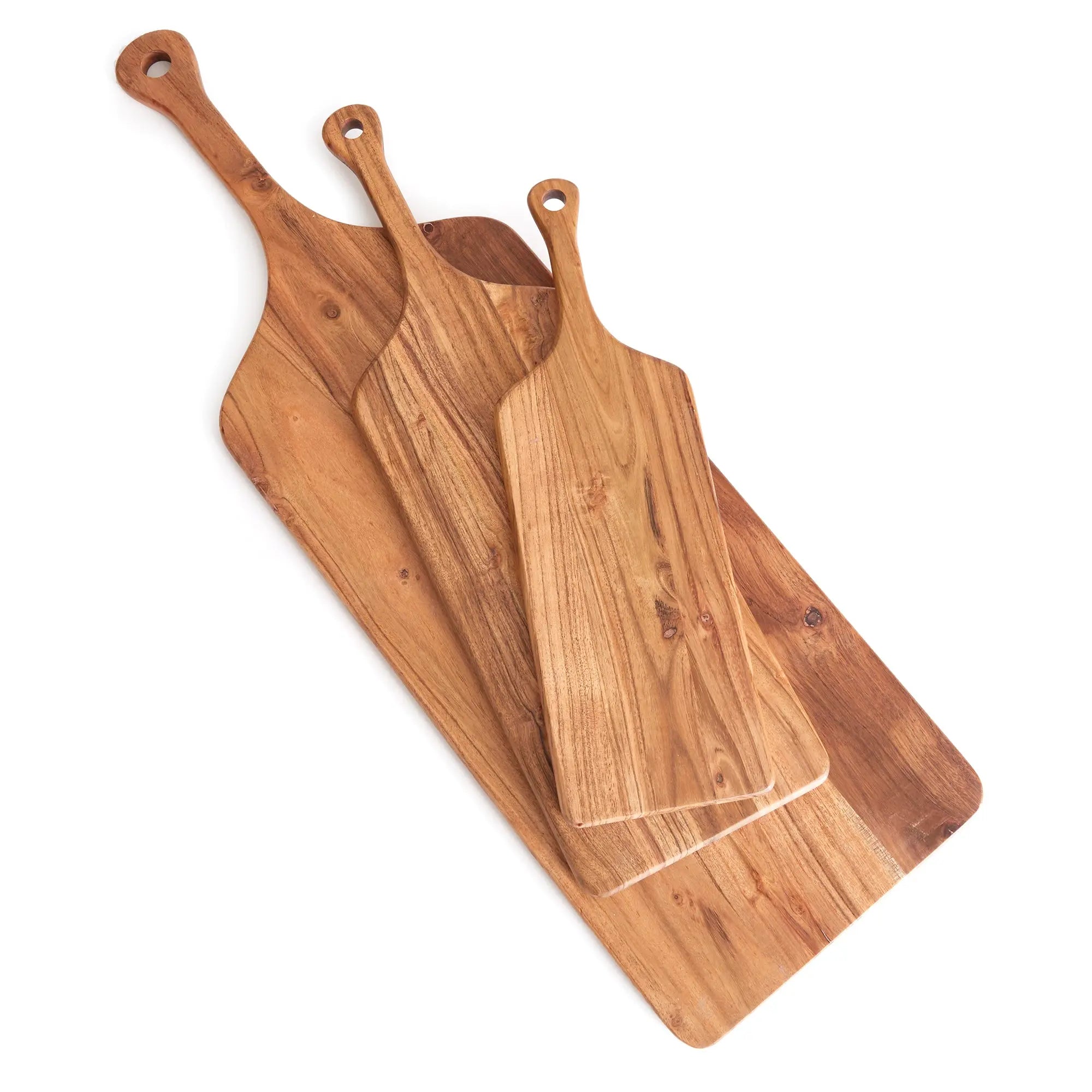 Three wooden cutting boards of different sizes on a white background