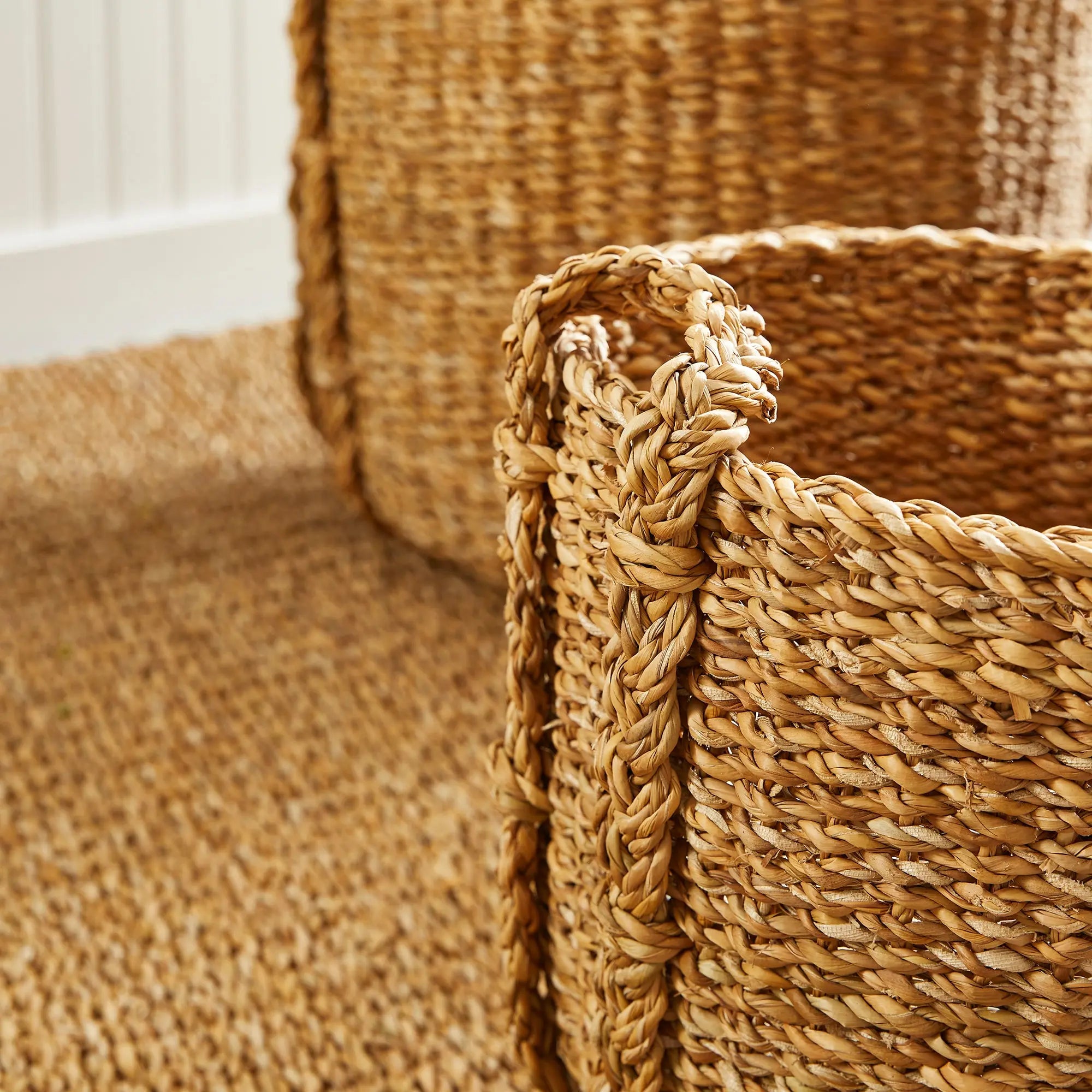 Close-up of a woven basket with a textured background