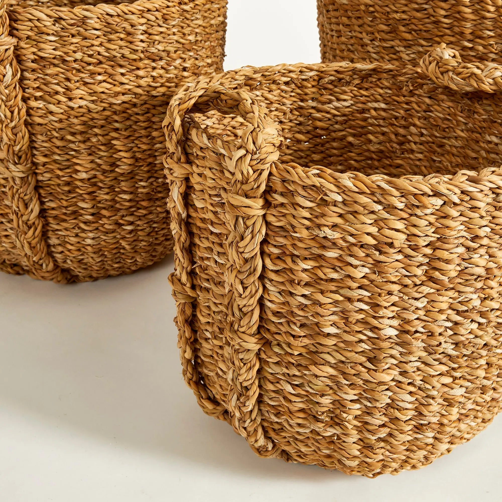 Close-up of woven baskets with a neutral background