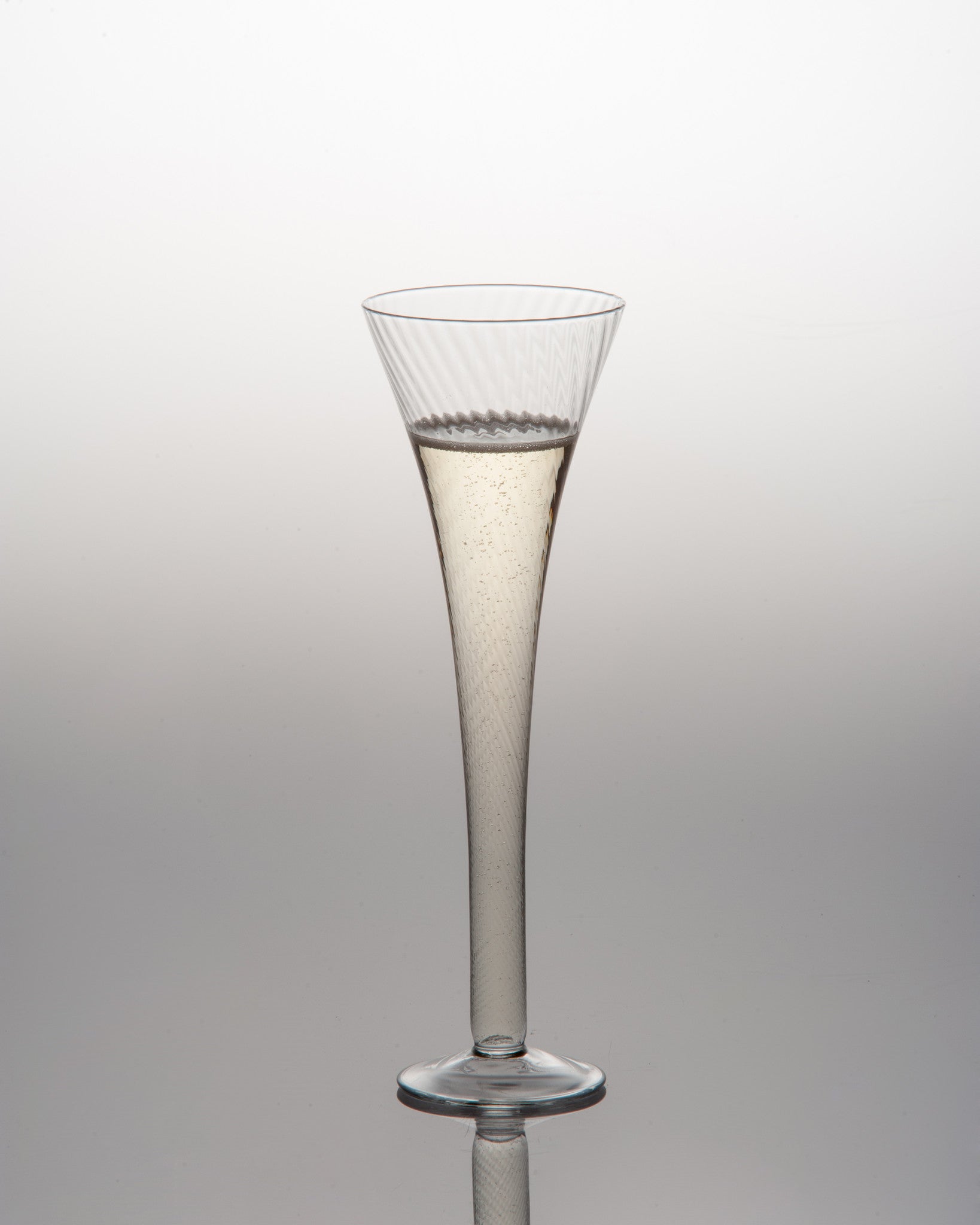 Optic design champagne flute with blown glass pattern - elegant clear glass barware that doubles as decorative flower vase