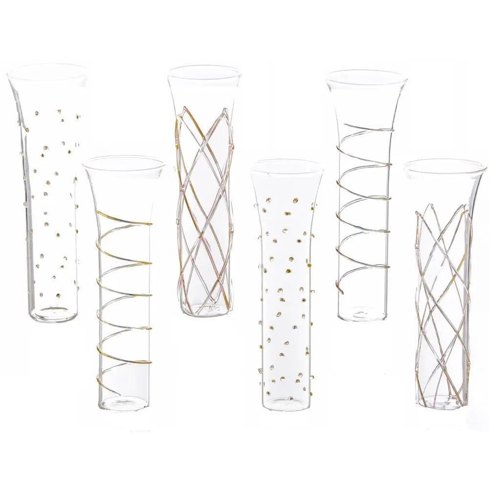 A set of six clear glass stemless champagne flutes with a geometric raised design.