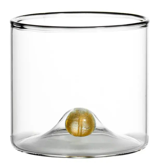 Set of four Golden Globe Double Old-Fashioned Glasses, each featuring a clear glass body with a small gold ball fused into the base