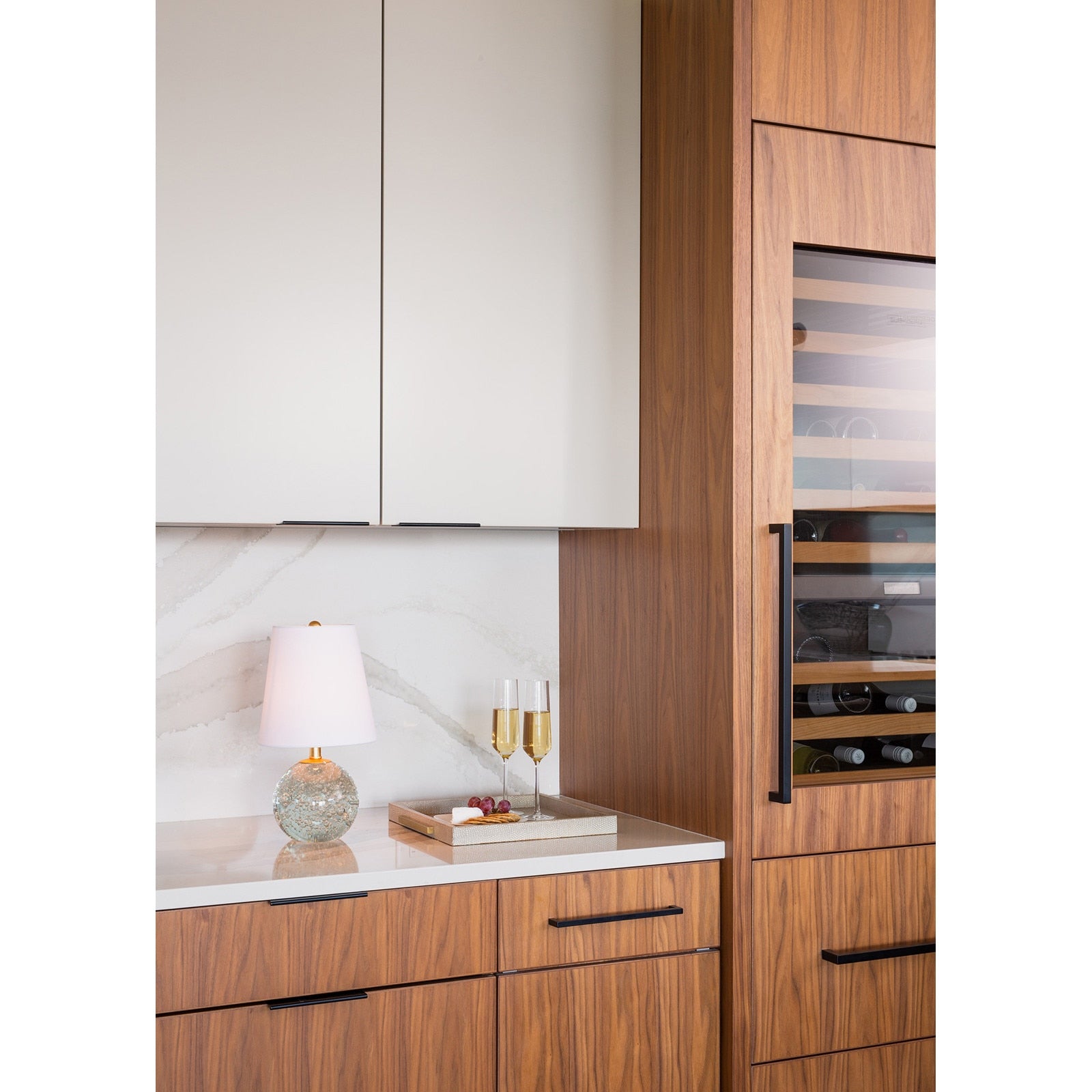 Bulle Crystal Mini Lamp (15" H) with a round clear crystal base containing internal bubbles, gilded neck, and a natural tapered linen shade.