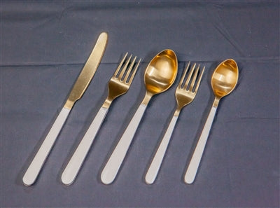 5pc Gold Flatware Place Setting with sleek White Resin Handles. Includes 5 pieces in a gift box. Luxurious, modern, and perfect for elegant dining. Hand wash only.