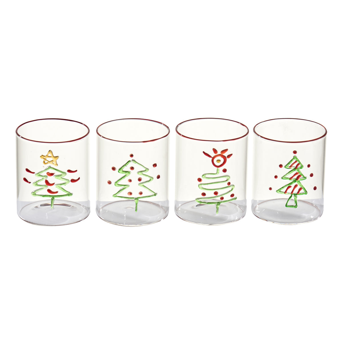 Four glass tumblers with Christmas tree designs on a white background