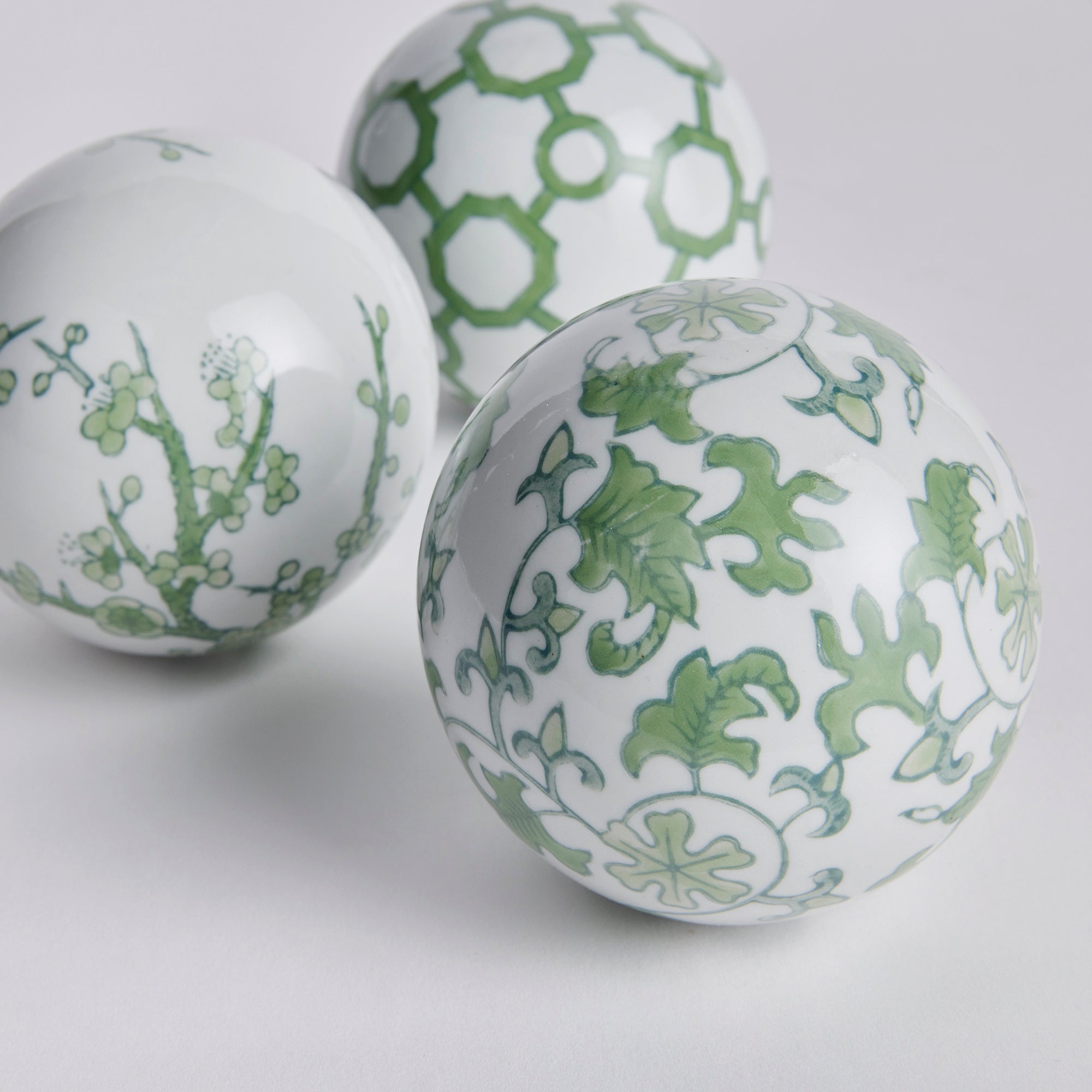 Imperial Orbs Set of 3 - handcrafted green and white chinoiserie ceramic spheres with coordinating patterns for elegant home décor