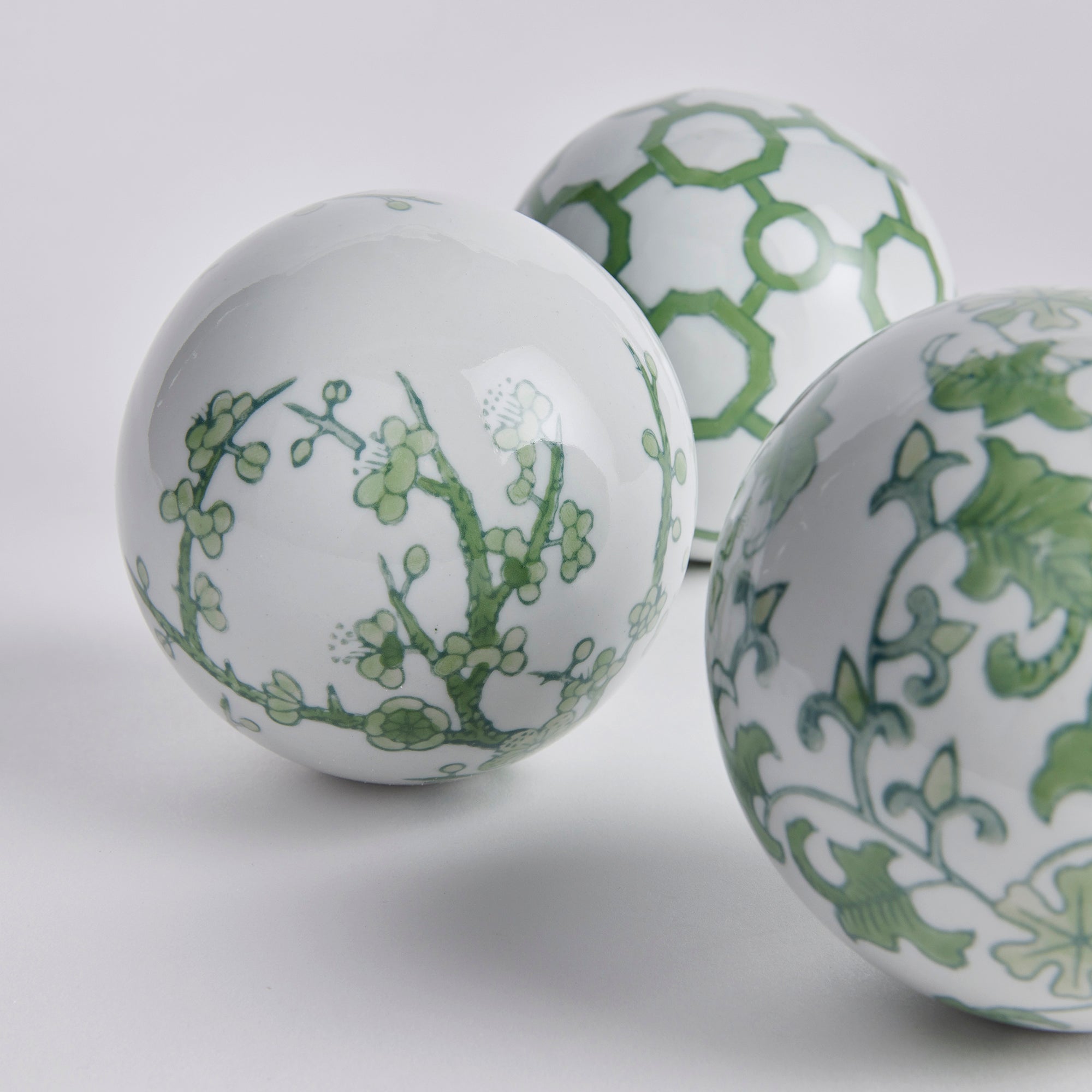 Imperial Orbs Set of 3 - handcrafted green and white chinoiserie ceramic spheres with coordinating patterns for elegant home décor
