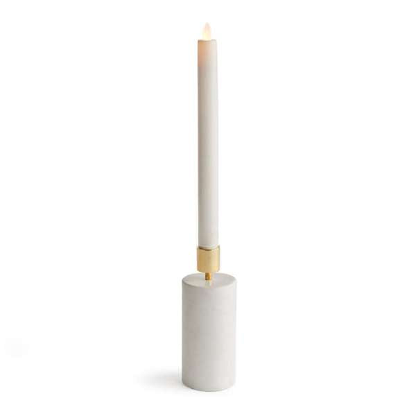 Avalyn Taper Holder, showing a modern taper candle holder with a square white marble base and a cylindrical brushed brass top. The holder is empty and is shown from a slight angle against a neutral background.