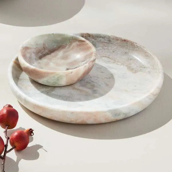 Round Josephine Marble Tray with a flat surface and low rim, featuring distinctive broad brown and light brown veins on a white marble base with a honed finish.